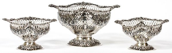 VICTORIAN STERLING SWEETMEAT BASKETS BY HARRIS: VICTORIAN STERLING SWEETMEAT BASKETS BY CHARLES STUART HARRIS, LONDON, 1893-94, THREE, H 3" & 4":A matched set of sterling silver sweetmeat baskets, including 1 measuring H.4 1/4" x 7 3/4" x 5 7/8", a