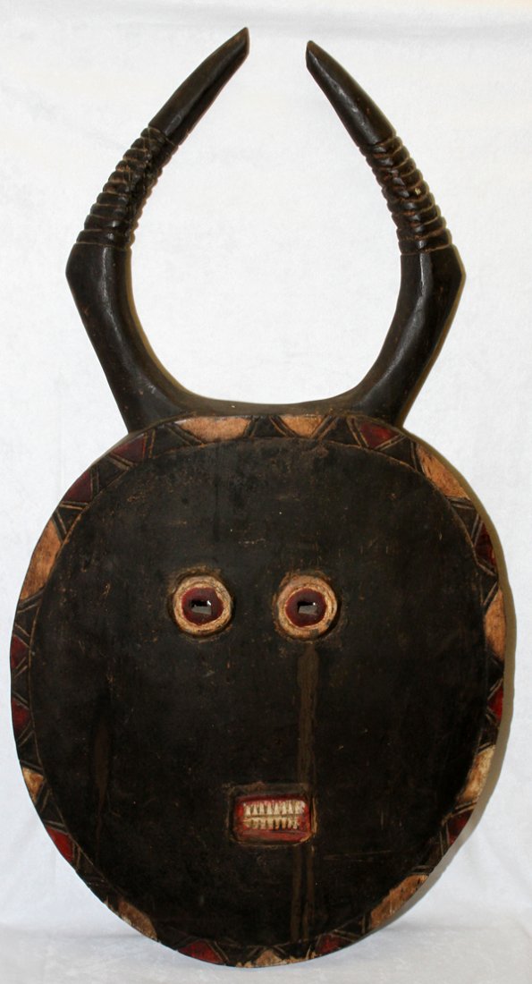 CARVED WOOD AFRICAN MOON MASK, 36" X 19": CARVED WOOD AFRICAN MOON MASK, 36" X 19":Pre World War II. From the estate of Gerry Culpepper, Northville, Mi.