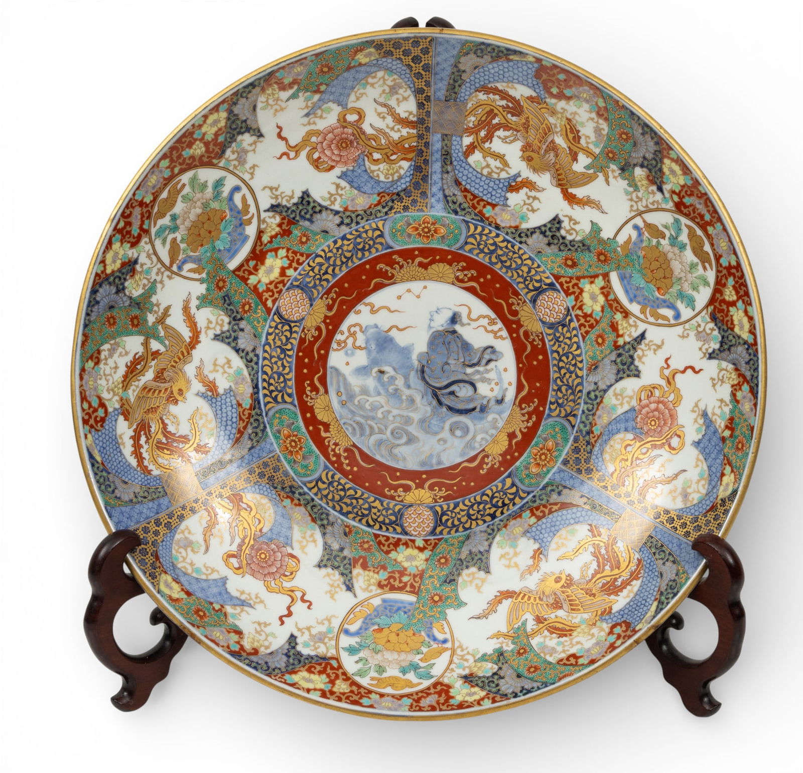Japanese Imari Porcelain Charger, Ca. Late 19th C., Dia. 18.75": Japanese Imari Porcelain Charger, Ca. Late 19th C., Dia. 18.75" Japanese Imari porcelain charger decorated with blue and white underglaze with hand applied enamel overglaze and gilt highlights. Centra