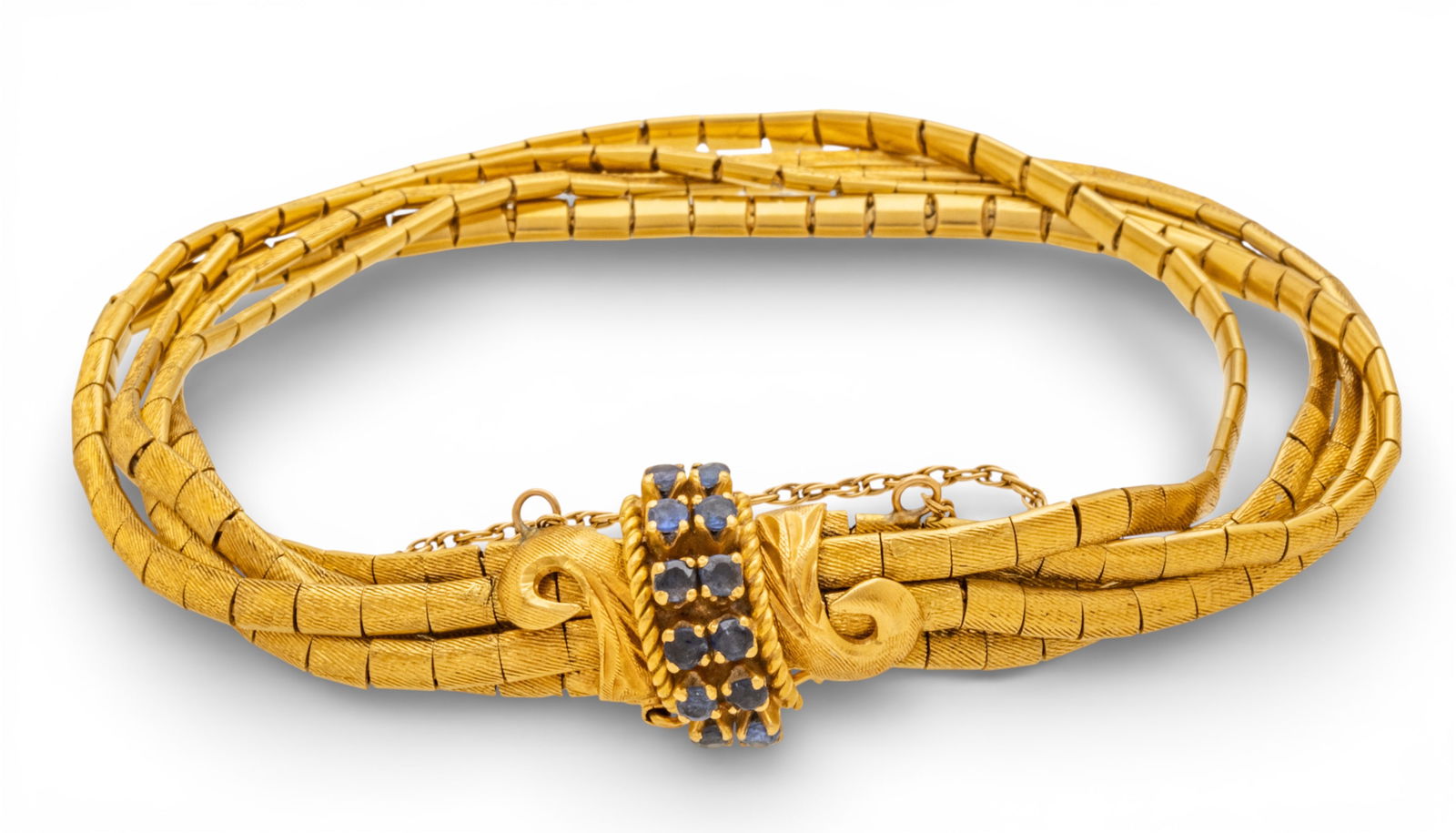 Italian 18k Yellow Gold and Sapphire Multistrand Bracelet 20th Century, L 7" 34.96 g: Italian 18k Yellow Gold and Sapphire Multistrand Bracelet 20th Century, L 7" 34.96 g An 18k brushed-finish, yellow gold five strand link bracelet having 12 round sapphires and gold scrolling accents.