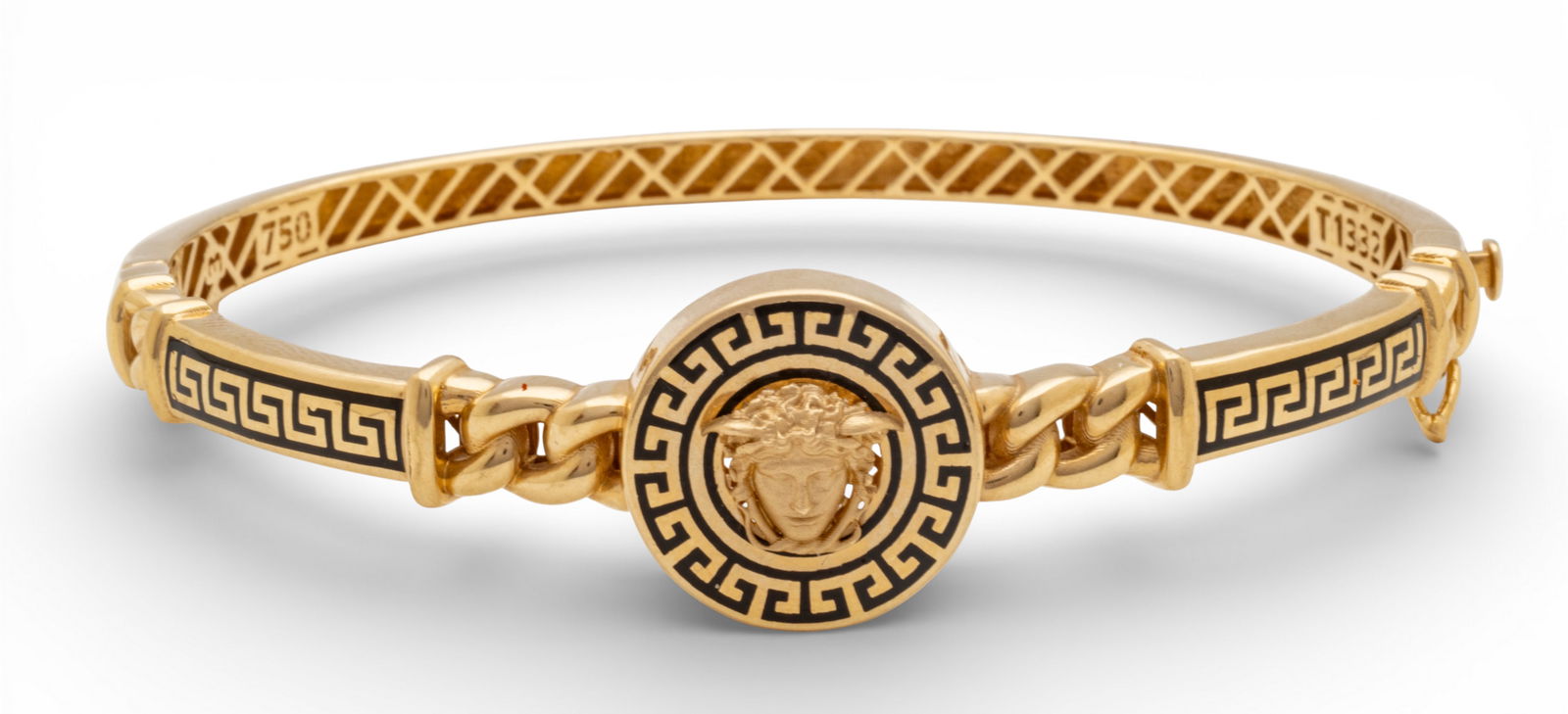 18k Yellow Gold and Black Enamel Medusa Bangle Bracelet 10.8 g: 18k Yellow Gold and Black Enamel Medusa Bangle Bracelet 10.8 g A Medusa Icon 18k yellow gold and enamel bangle bracelet having a hinge and box clasp with safety catch. Marked 750 and T1332 integrated