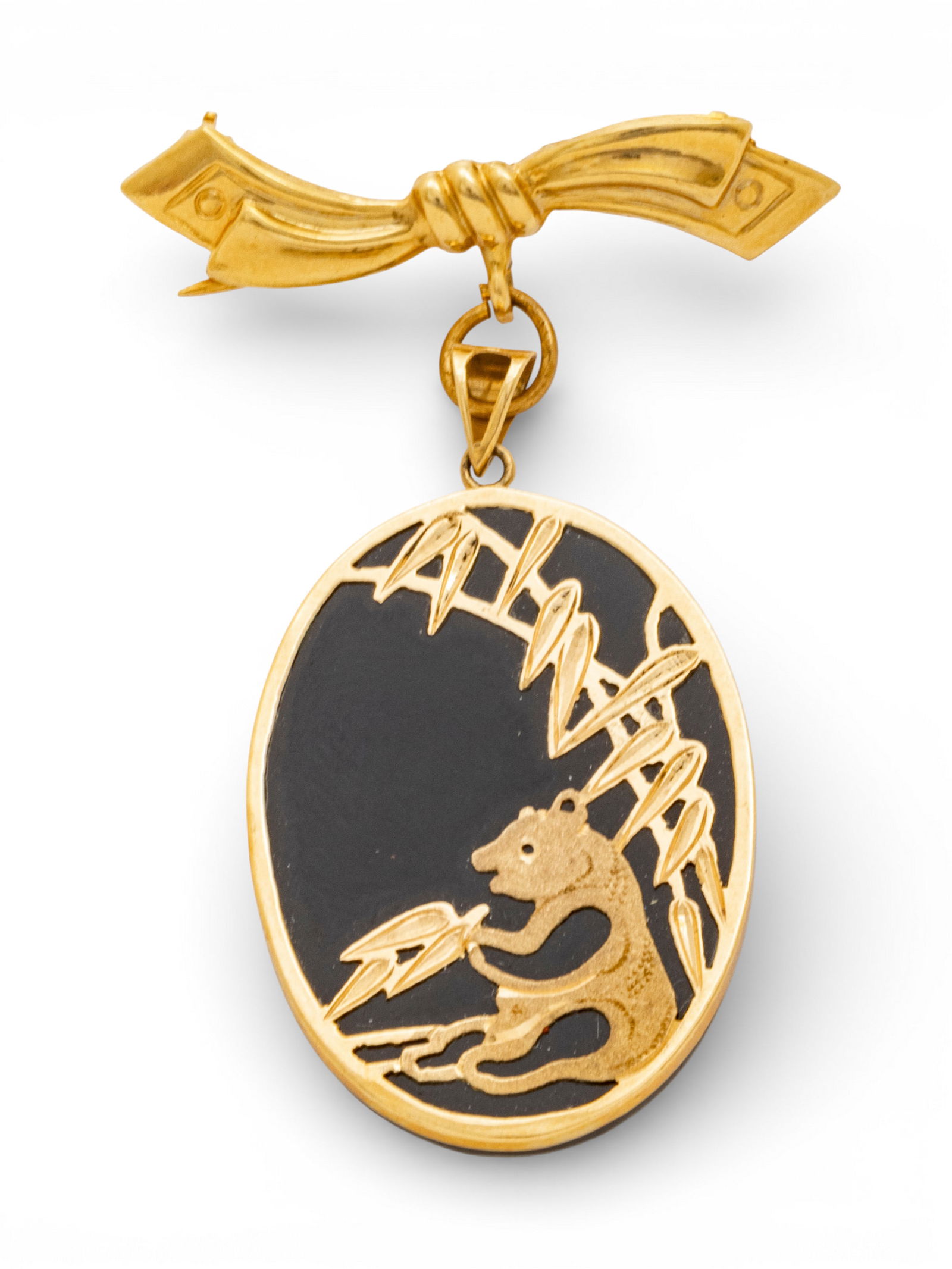 14k Yellow Gold and Onyx Panda Brooch H 1.75": 14k Yellow Gold and Onyx Panda Brooch H 1.75" A drop brooch having a black onyx gemstone bezel set in 14k yellow gold depicting a panda bear eating bamboo. Ying yang hallmark and 14k stamped to bale.