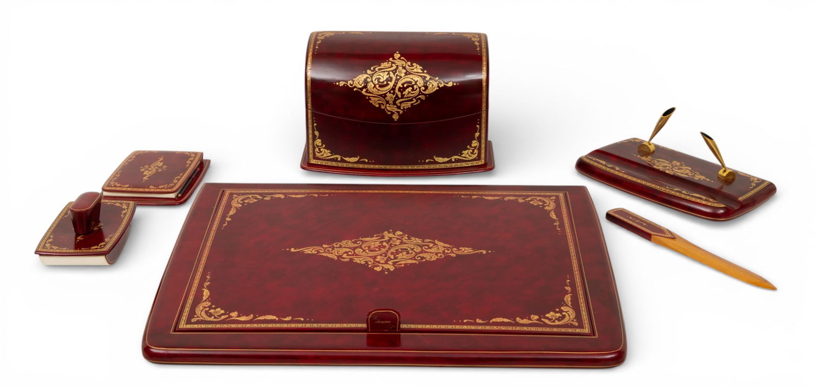 Florentine Leather Desk Set: Letter, Blotter, Letter Opener, Pen Holder, and Writing Case with Cover: Florentine Leather Desk Set: Letter, Blotter, Letter Opener, Pen Holder, and Writing Case with Cover 5 PCS Five-piece Italian desk set in red leather with scrolling tooled gold accents. Blotter H 2.5"