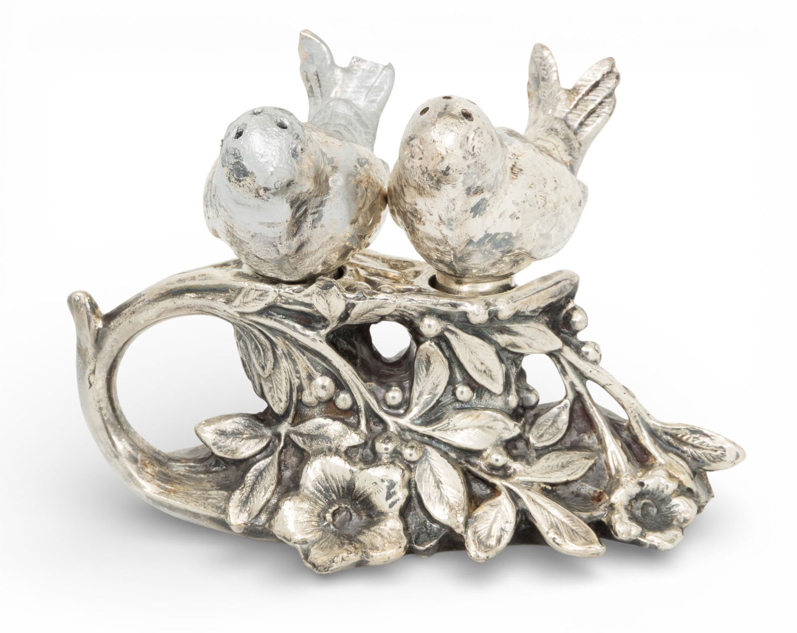 Sparrow Form Salt and Pepper Shakers on Stand 1900, H 3.5" W 4" 1 SET: Sparrow Form Salt and Pepper Shakers on Stand 1900, H 3.5" W 4" 1 SET Vintage Silver plate set. Two birds in the form of salt and pepper shakers fit into a lily, berry and leaf base. Provenance: