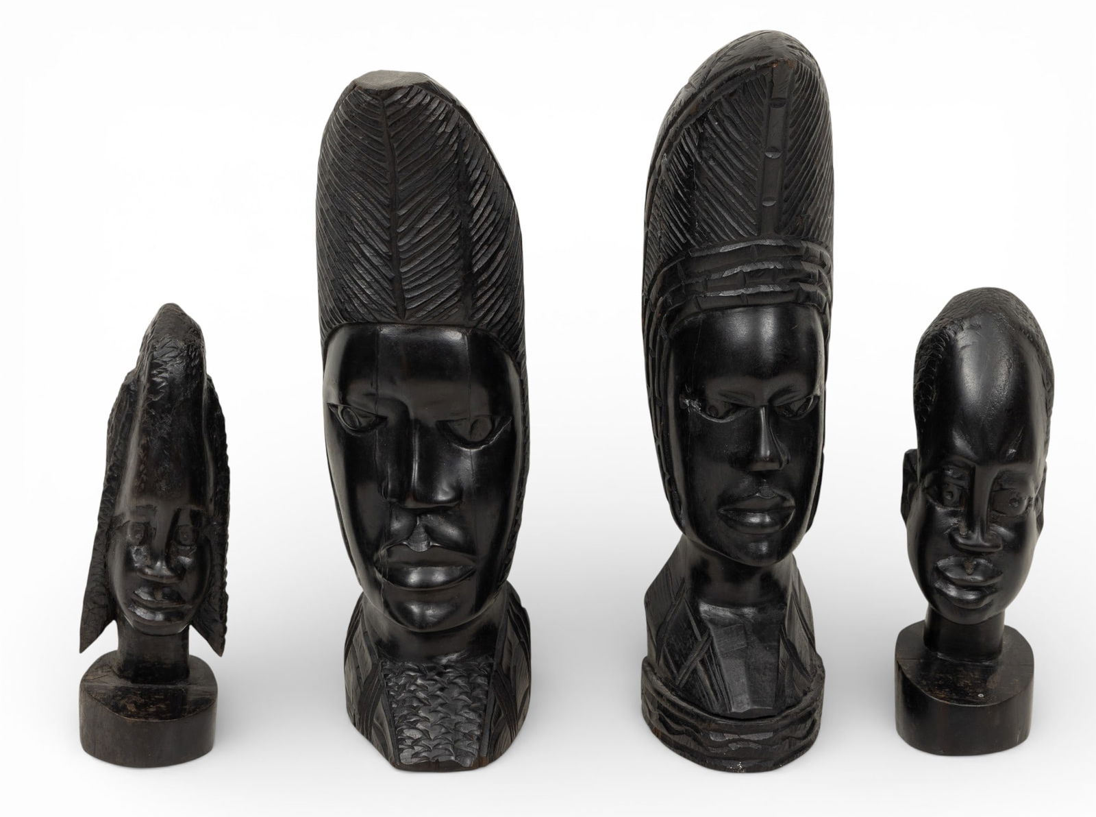 Salisbury, Rhodesia Carved Ebony Wood Heads, 14" and 8" 1970, 4 PCS: Salisbury, Rhodesia Carved Ebony Wood Heads, 14" and 8" 1970, 4 PCS Two heads @ 11" and two @ 7". Each head carved in one heavy single piece of wood. Dimensions: 4 PCS