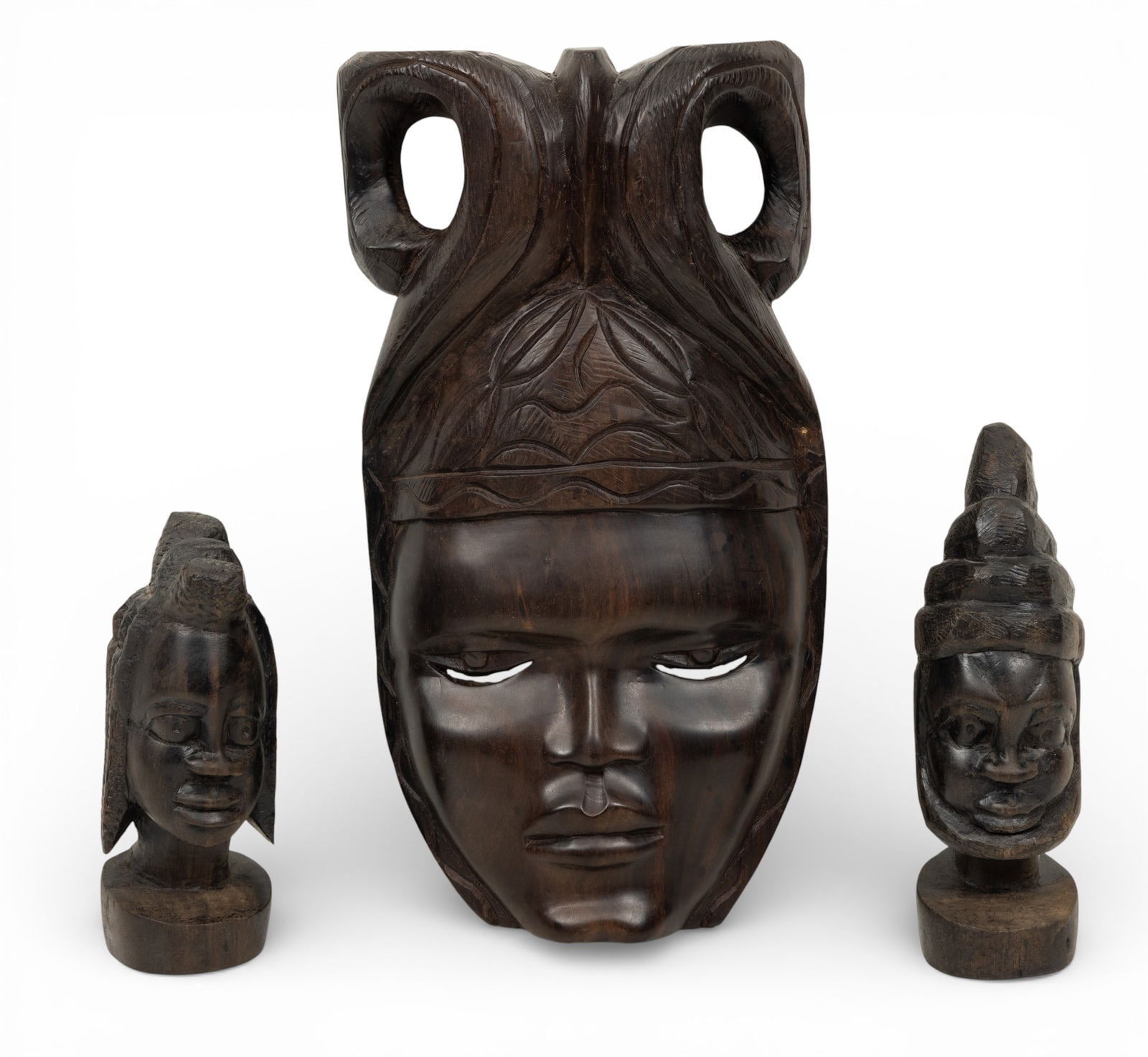 Salisbury, Rhodesia Ebony Wood Mask 14" X 7" + 2 Carved Heads 8" 1970, 3 PCS: Salisbury, Rhodesia Ebony Wood Mask 14" X 7" + 2 Carved Heads 8" 1970, 3 PCS Carved ebony wood mask is very well carved and very heavy. Two female carved wood heads. Dimensions: 3 PCS