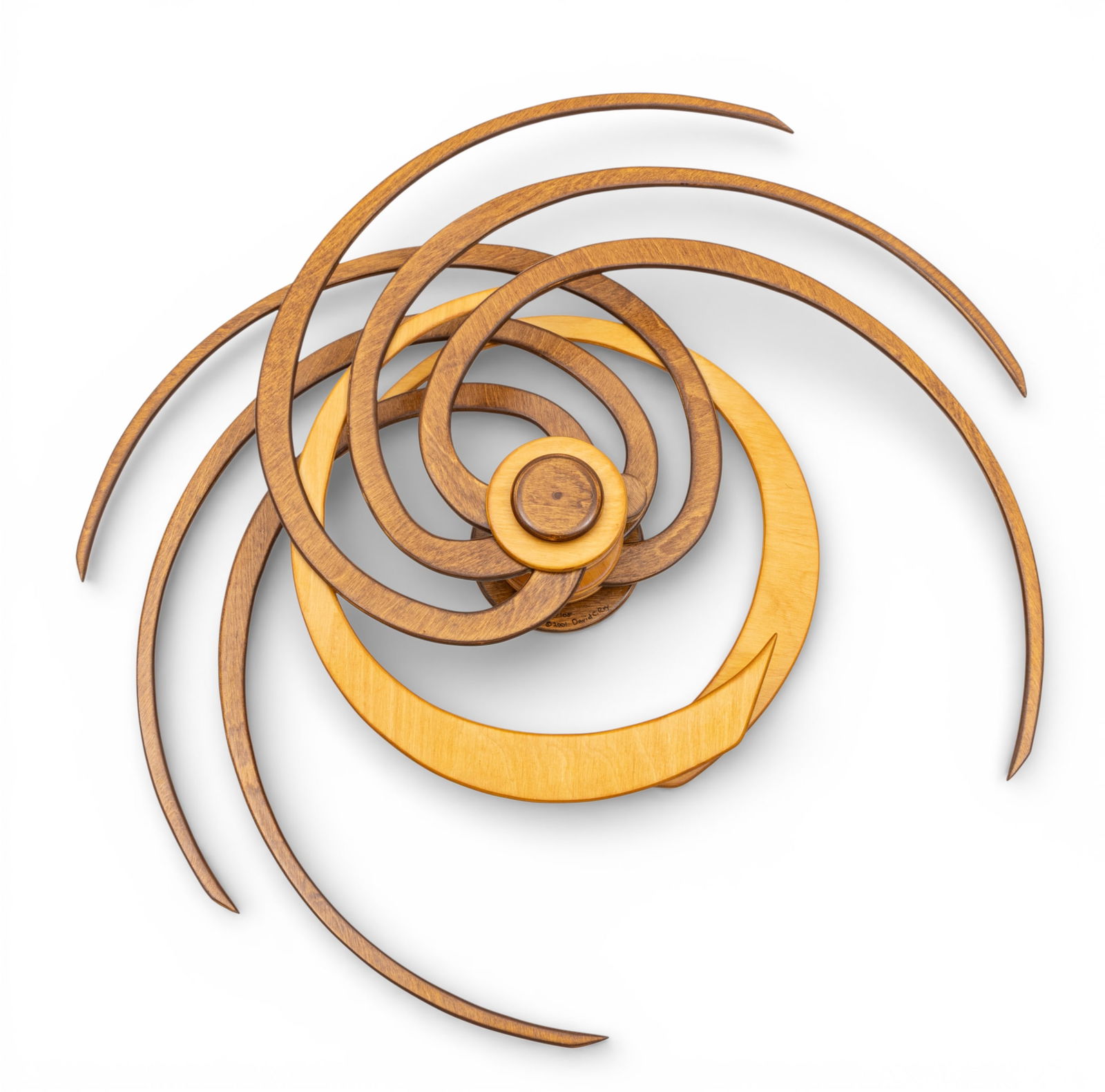 David C. Roy (American, B. 1952) Baltic Birch Kinetic Wall Sculpture 2001, 'Tapestry', SN: 95/105,: David C. Roy (American, B. 1952) Baltic Birch Kinetic Wall Sculpture 2001, 'Tapestry', SN: 95/105, Depth 5.5" Dia. 33" Lightly contrasted layers of plywood rotate from a central spring rachet mechanis