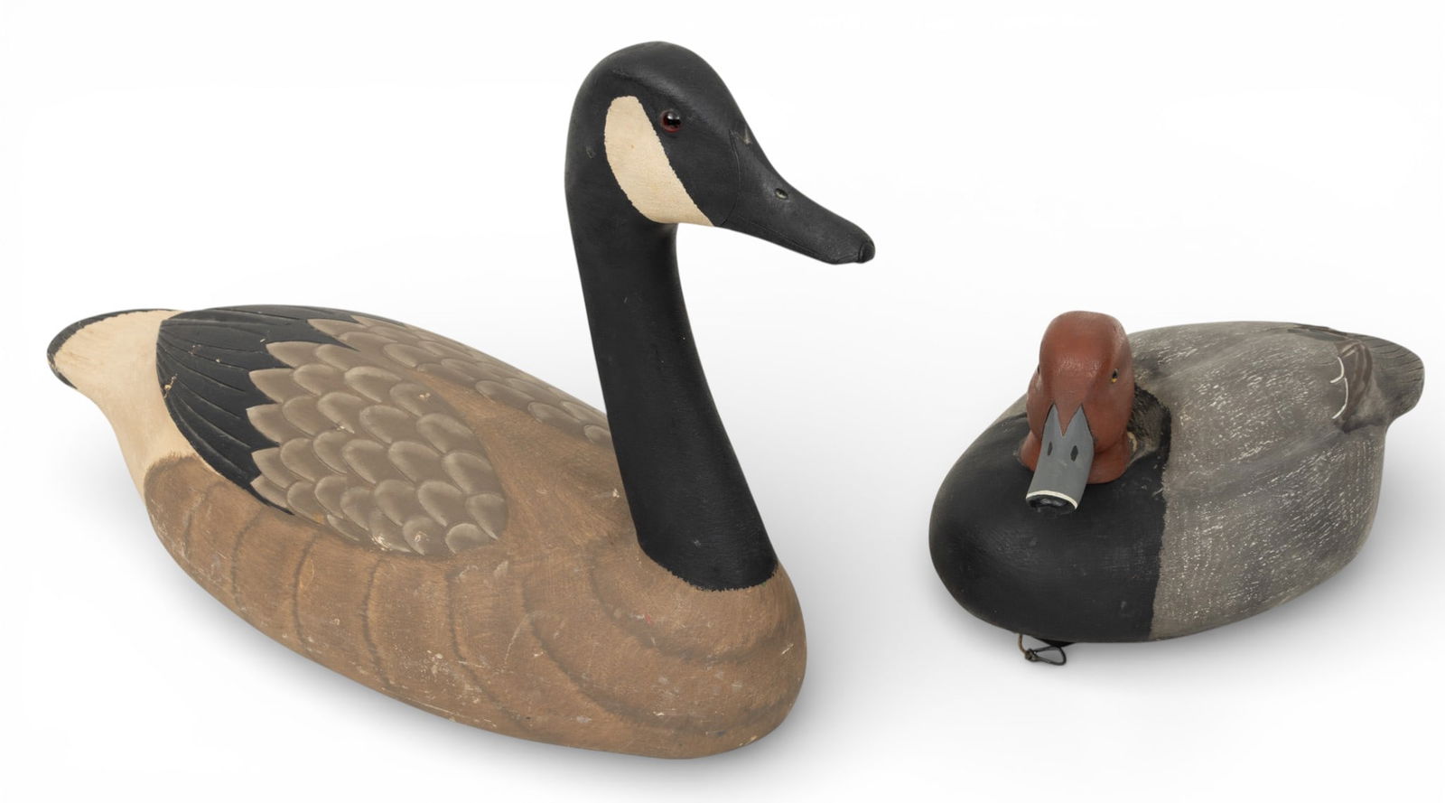 Chuck Kalucka (Michigan) Hand Carved and Painted Wood Decoys, Canadian Goose and Redhead Duck, Ca.: Chuck Kalucka (Michigan) Hand Carved and Painted Wood Decoys, Canadian Goose and Redhead Duck, Ca. 1980s, 2 PCS Two accurately proportioned and colored solid body decoys. Both pieces marked "CK" on th