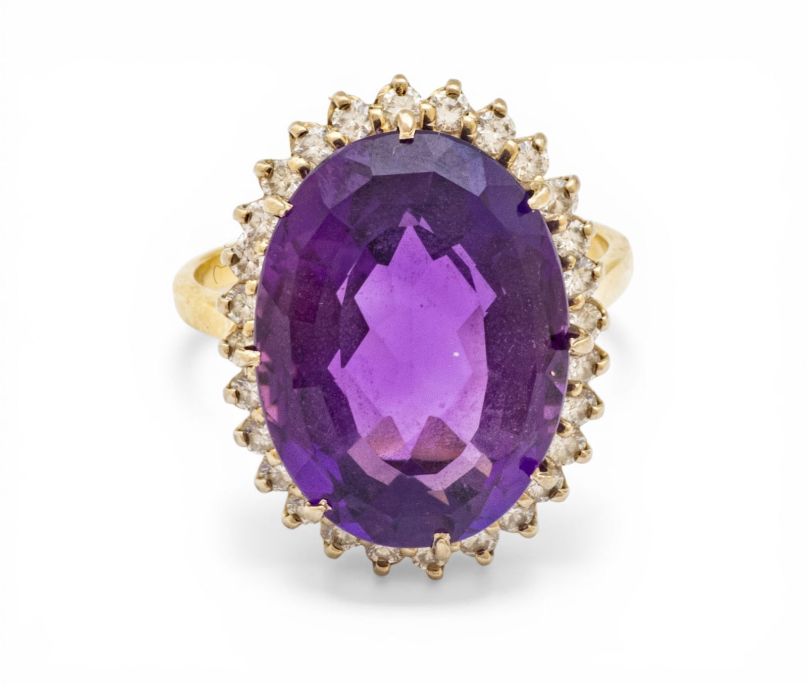 Amethyst and Diamond 14K Gold Ring 9 7 g 1 PC: Amethyst and Diamond 14K Gold Ring 9 7 g 1 PC Impressed 14K. 18 x 13mm. Deep purple color, faceted oval and prong set. Surrounded by approximately 26 Full cut and prong set diamonds Provenance: