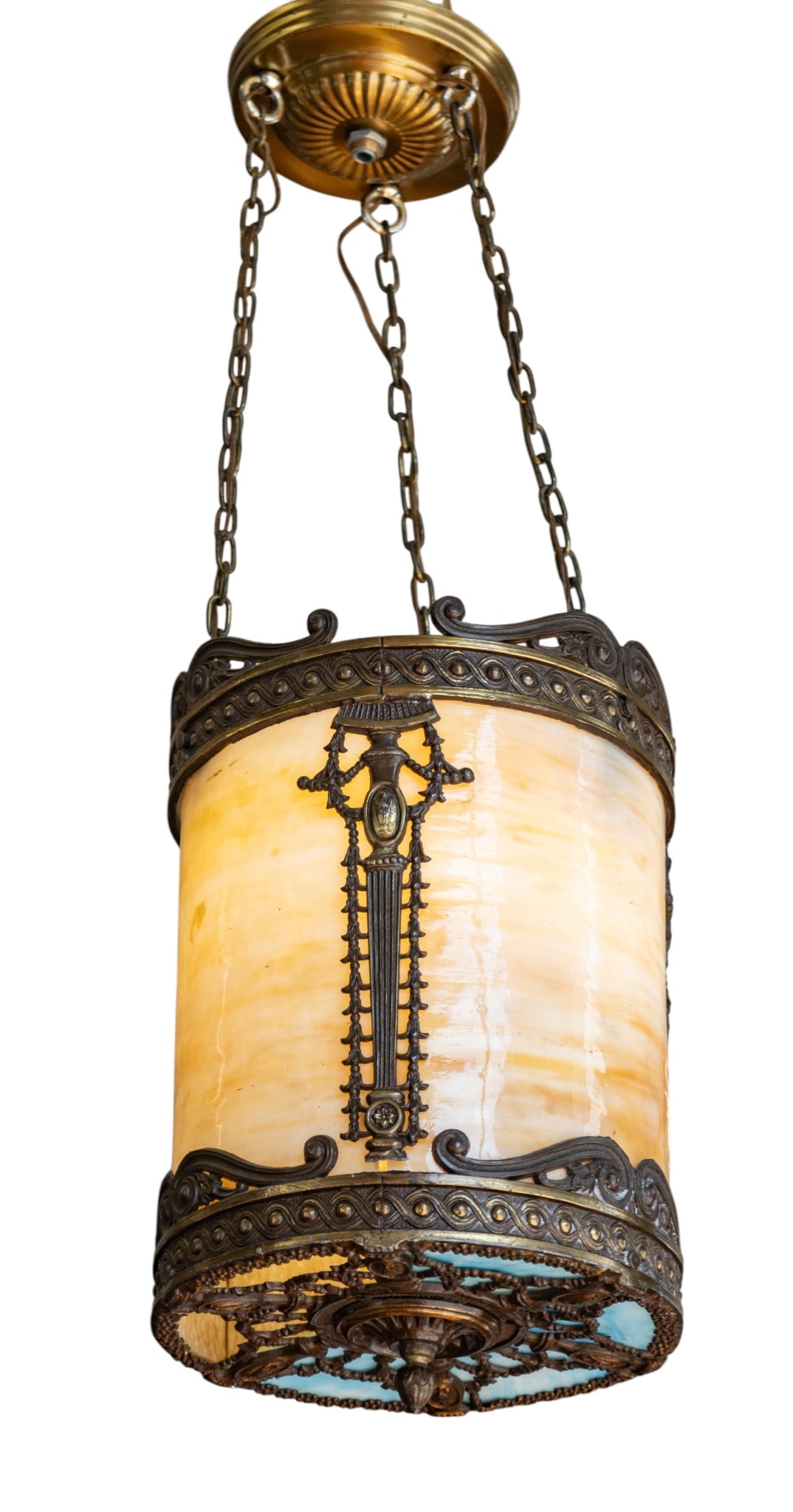 American Art Deco Period Bent Slag Glass Foyer Pendant Light 1920-1930, H 12" Dia. 8.5": American Art Deco Period Bent Slag Glass Foyer Pendant Light 1920-1930, H 12" Dia. 8.5" Having four bent glass panels within a cylindrical frame adorned with classically inspired motifs. Blue inset sl