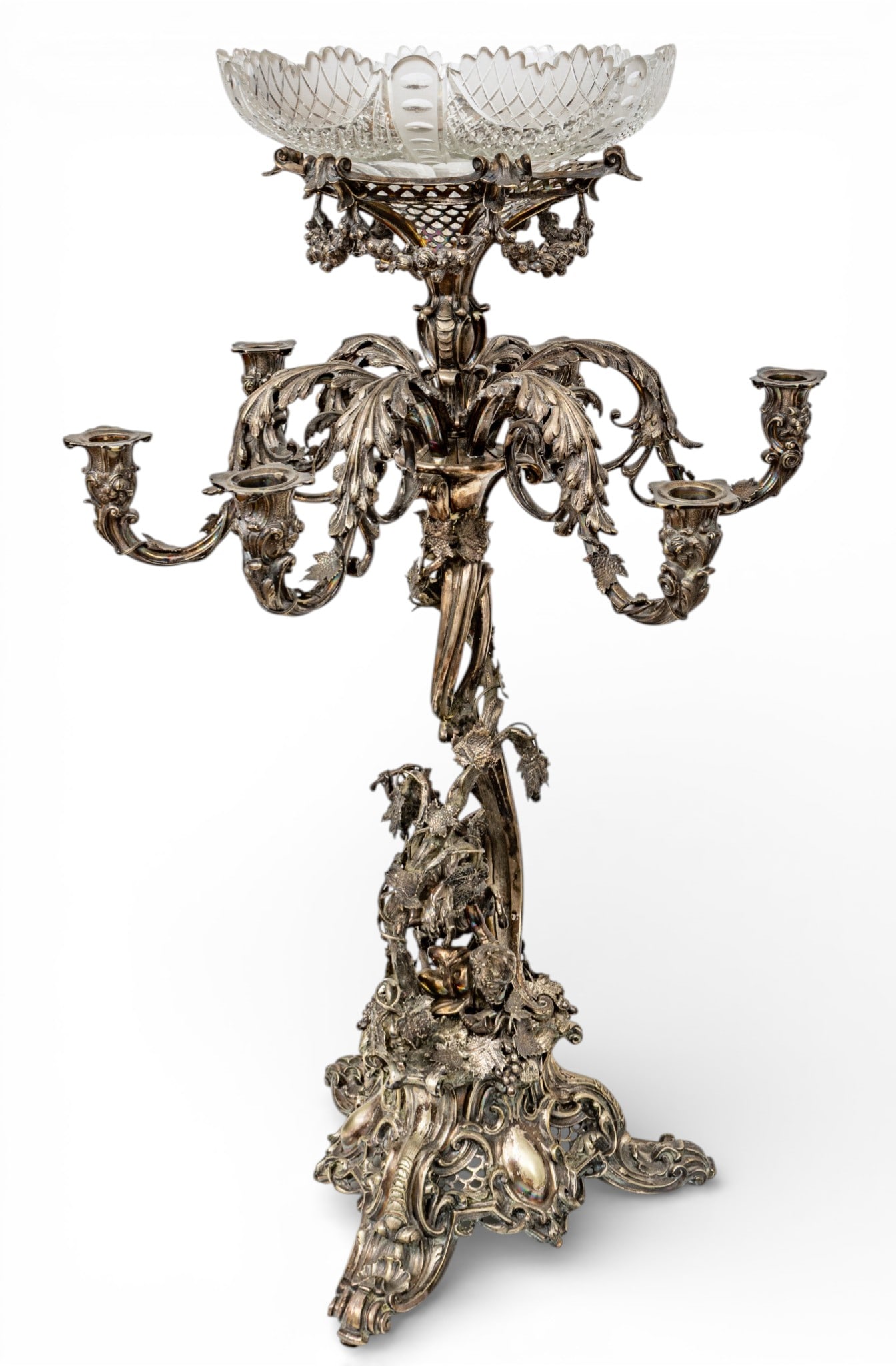 Silverplate Centerpiece Epergne 19th.c., H 31" W 19": Silverplate Centerpiece Epergne 19th.c., H 31" W 19" Candelabras base with six candle arms. Surmounted by hand cut brilliant period crystal fruit or flower bowl Dia 10". Central figure of cherub ridin