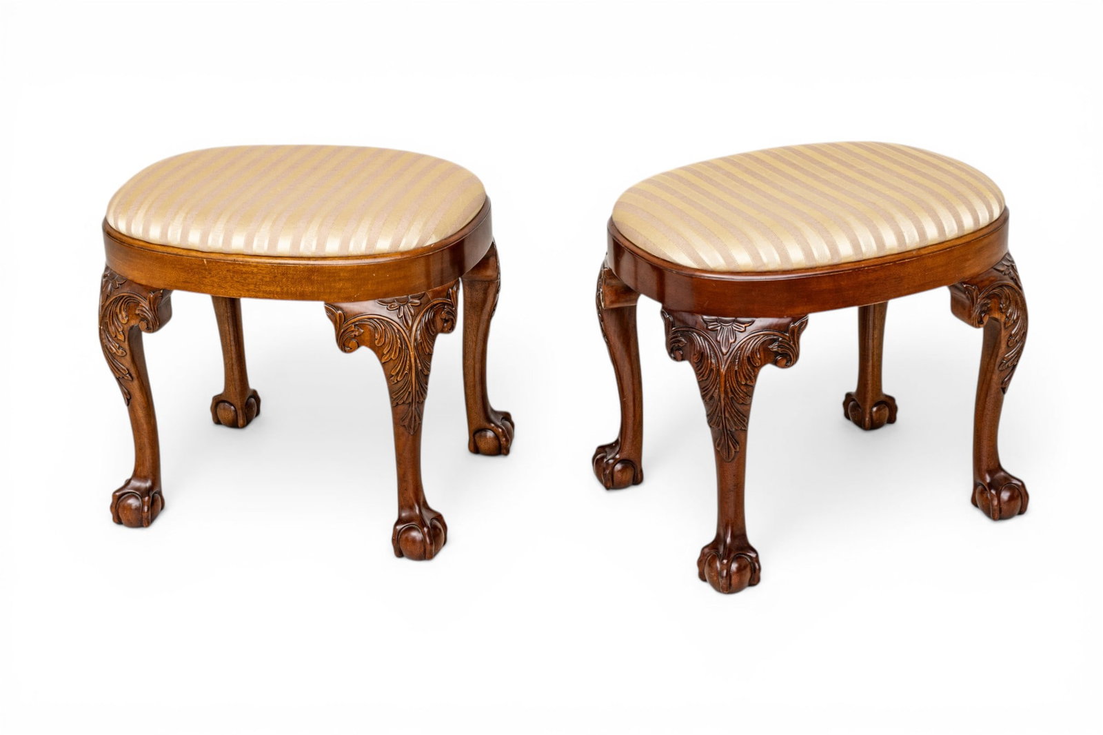 Kindel Furniture Company (American) Upholstered Footstools 20th C., H 18" W 19" Depth 13" 1 PAIR: Kindel Furniture Company (American) Upholstered Footstools 20th C., H 18" W 19" Depth 13" 1 PAIR Upholstered seats , raised on acanthus carved cabriole legs terminating in ball-and-claw feet. Provenan