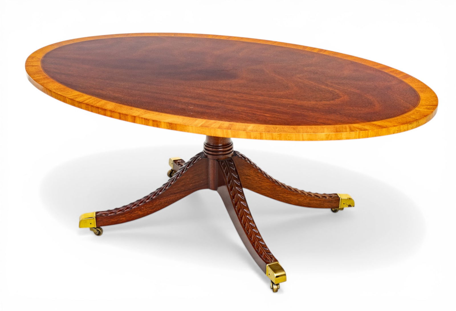 Kindel Furniture Company (American) Duncan Phyfe Style Mahogany Coffee Table 20th C., H 18" W 30" L: Kindel Furniture Company (American) Duncan Phyfe Style Mahogany Coffee Table 20th C., H 18" W 30" L 48.5" Mahogany with inlaid banding, acanthus leaf motif on downswept legs, brass toes & castors.