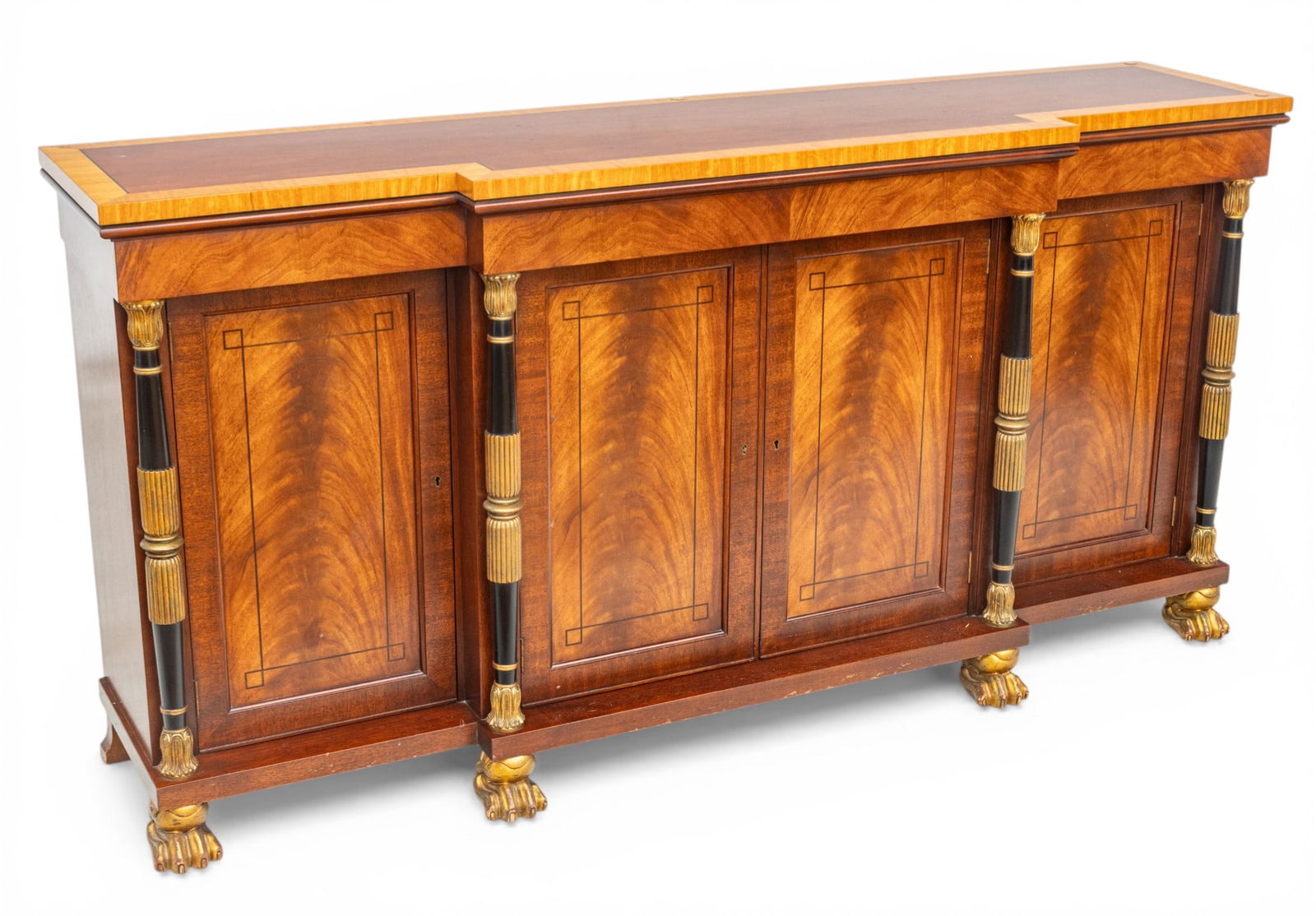 Baker Furniture (American) French Empire Mahogany Buffet Late 20th C., H 35.75" W 71.75" Depth 17.5": Baker Furniture (American) French Empire Mahogany Buffet Late 20th C., H 35.75" W 71.75" Depth 17.5" Banded top above four doors. Ebonized and gilt reeded columns. Raised on gilt paw feet. Baker