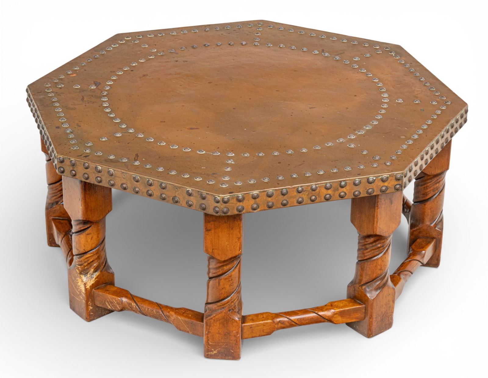 Continental European Hand Hammered Copper Clad Octagonal Coffee Table Early 20th C., H 14" Dia. 35": Continental European Hand Hammered Copper Clad Octagonal Coffee Table Early 20th C., H 14" Dia. 35" Octagonal hand hammered copper clad top with copper nail head design adorning top and sides. On an o