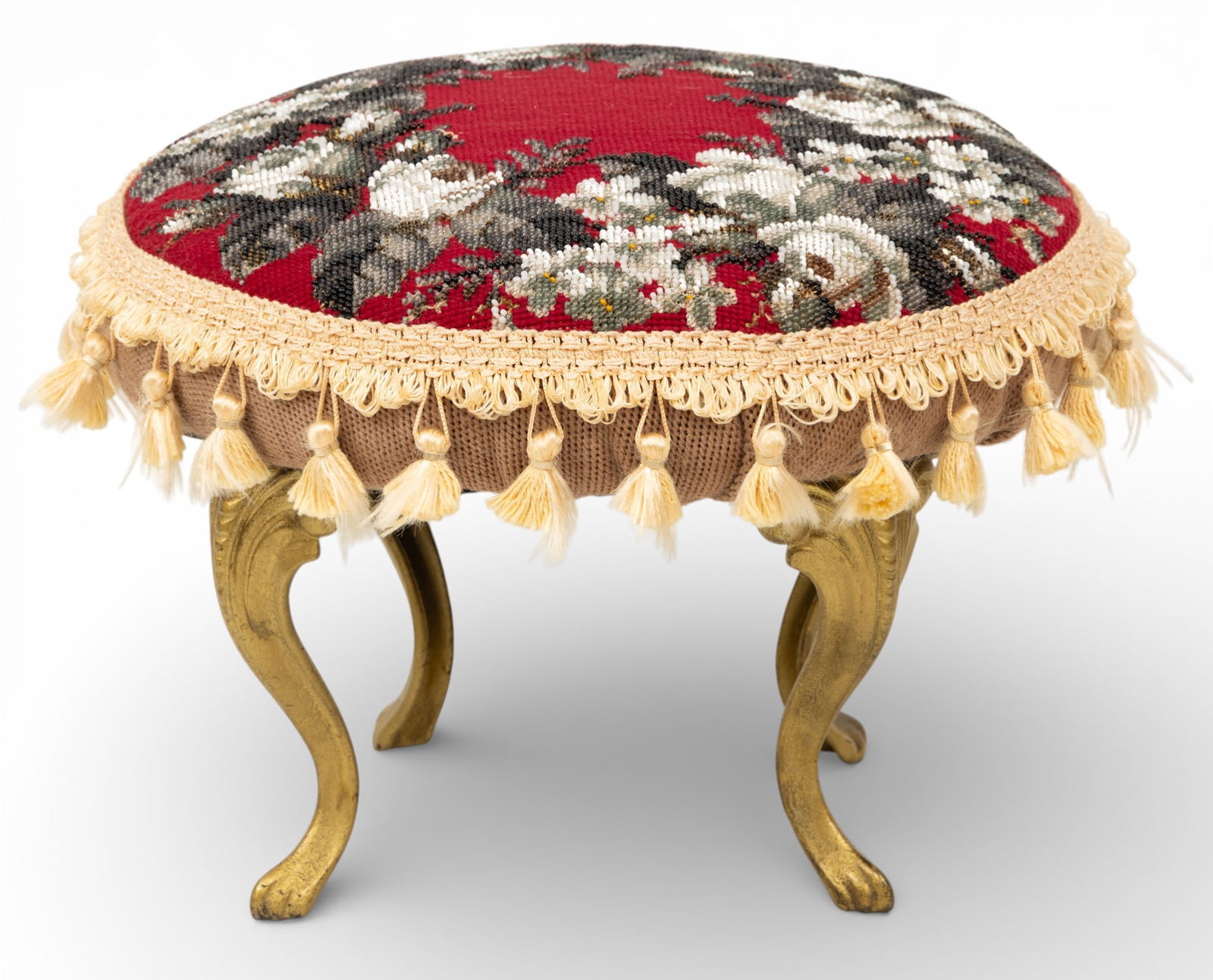 English Cast Iron Footstool 1900, H 9" Dia. 12": English Cast Iron Footstool 1900, H 9" Dia. 12" On four legs. Fine brocade depicts white roses against a red ground. Provenance: Property of a Bloomfield Hills, MI private collector. Dimensions: H 9"