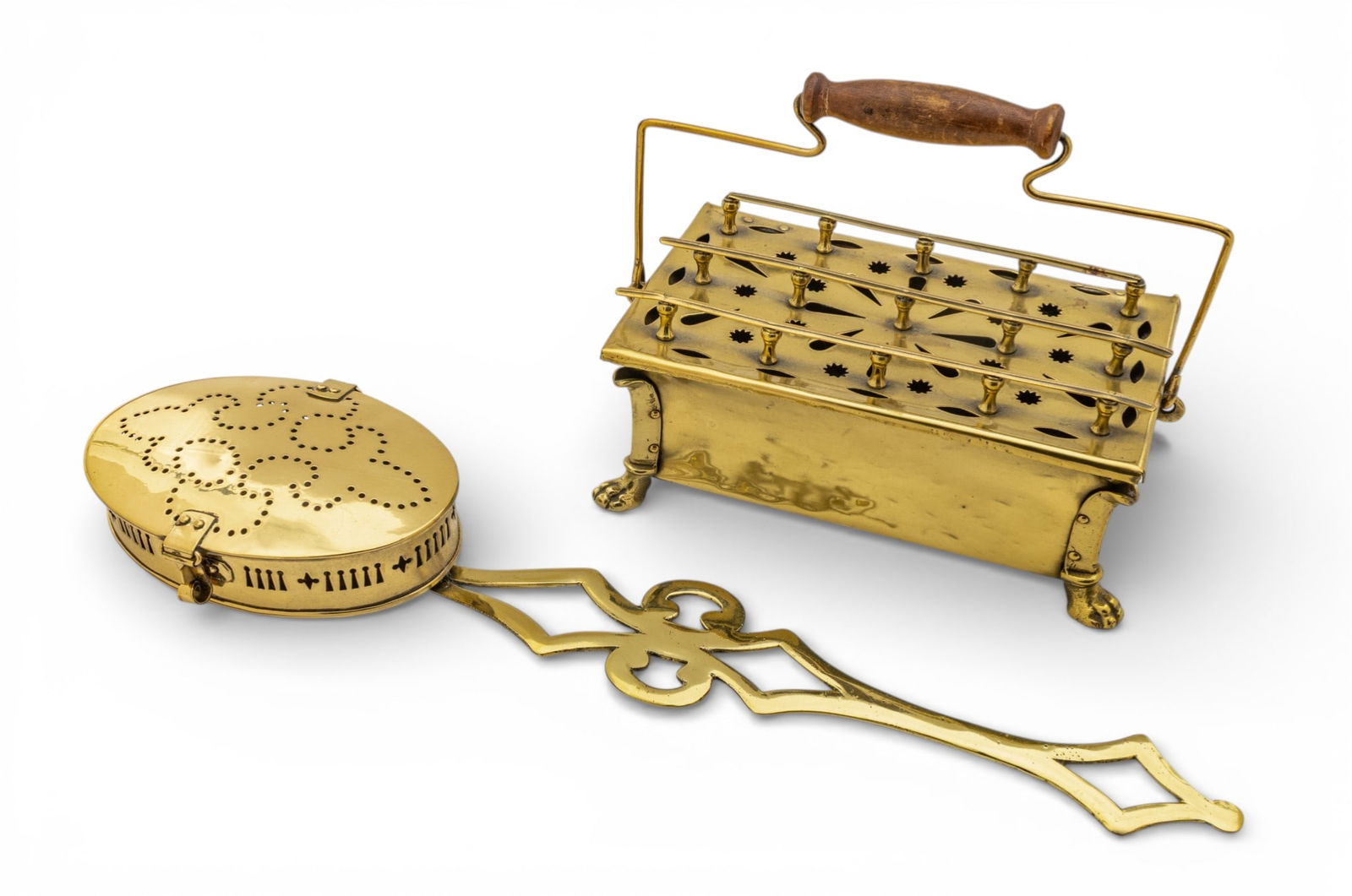 Brass Chestnut Roaster and Foot Warmer 2 PCS: Brass Chestnut Roaster and Foot Warmer 2 PCS Brass chestnut roaster 21" long and width 5". Long pierced handle and oval pierced hinged basket. Also: Brass foot warmer raised on claw feet, swing handle