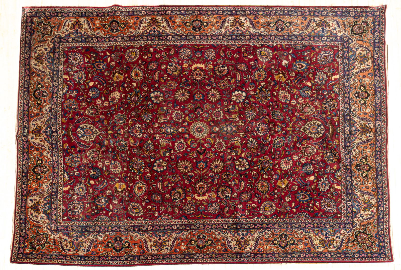 Persian Sarouk Handwoven Wool Rug, Ca. 1940-1950, W 10' L 12' 11": Persian Sarouk Handwoven Wool Rug, Ca. 1940-1950, W 10' L 12' 11" Central red field with overall floral designs. Rust outer border. Provenance: Property from the collection of Margarat Weerakoo