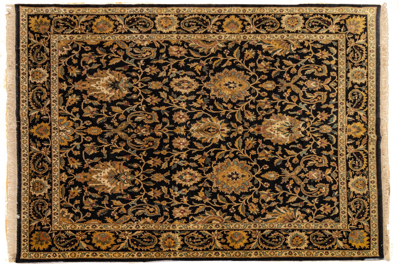 Indian Agra Handwoven Wool Rug, Ca. 1990, W 9' L 11': Indian Agra Handwoven Wool Rug, Ca. 1990, W 9' L 11' Dark indigo field with bold floral and vine design. Provenance: Property from the collection of Margarat Weerakoon, Oak Park, MI Dimensions: