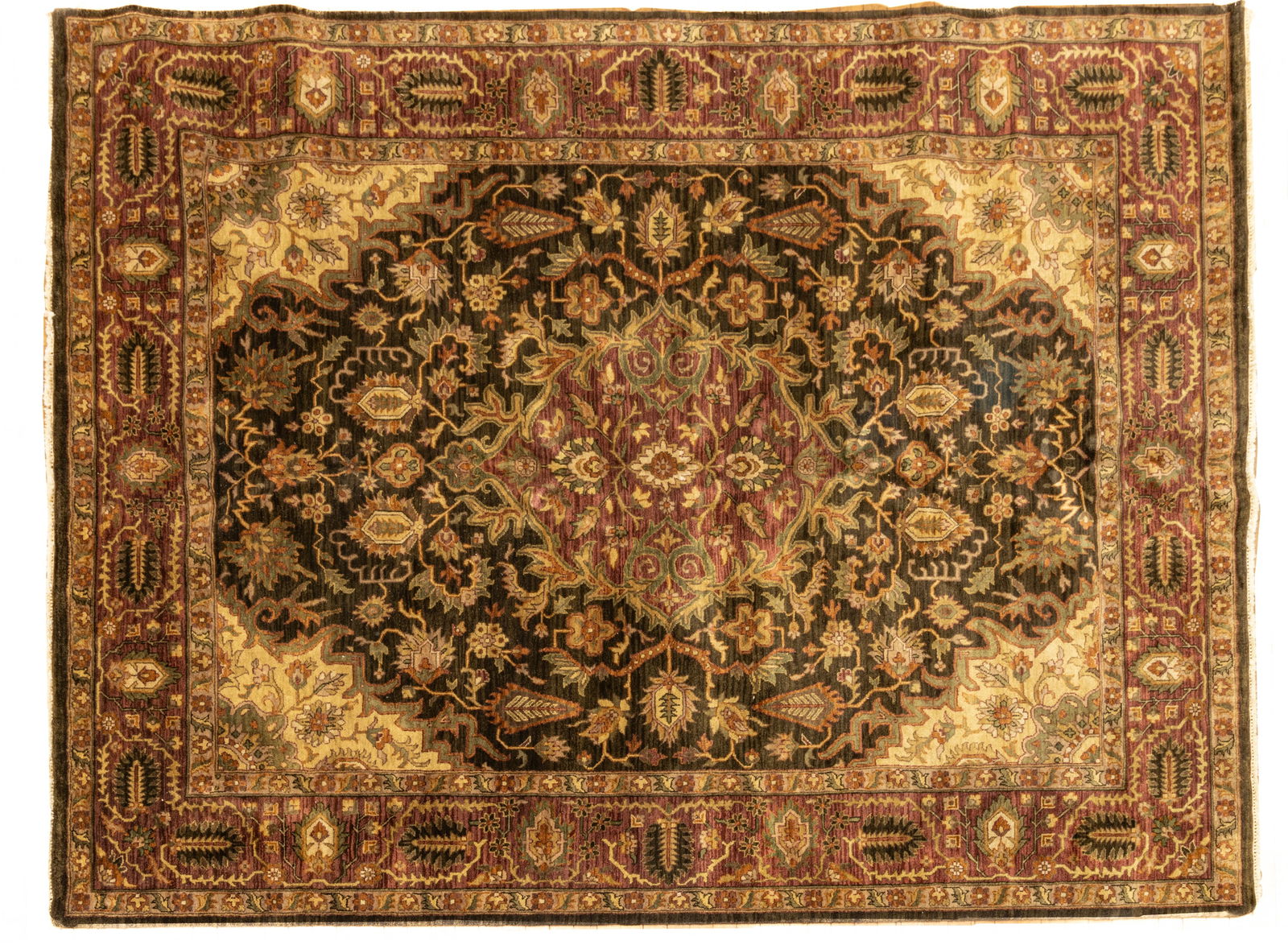 Indo-Kerman Handwoven Wool Rug, Ca. 1970, W 7' 9" L 11' 9": Indo-Kerman Handwoven Wool Rug, Ca. 1970, W 7' 9" L 11' 9" Black central field with oxblood medallion. All over floral and Cyprus tree motif. Provenance: Property from the collection of Margara