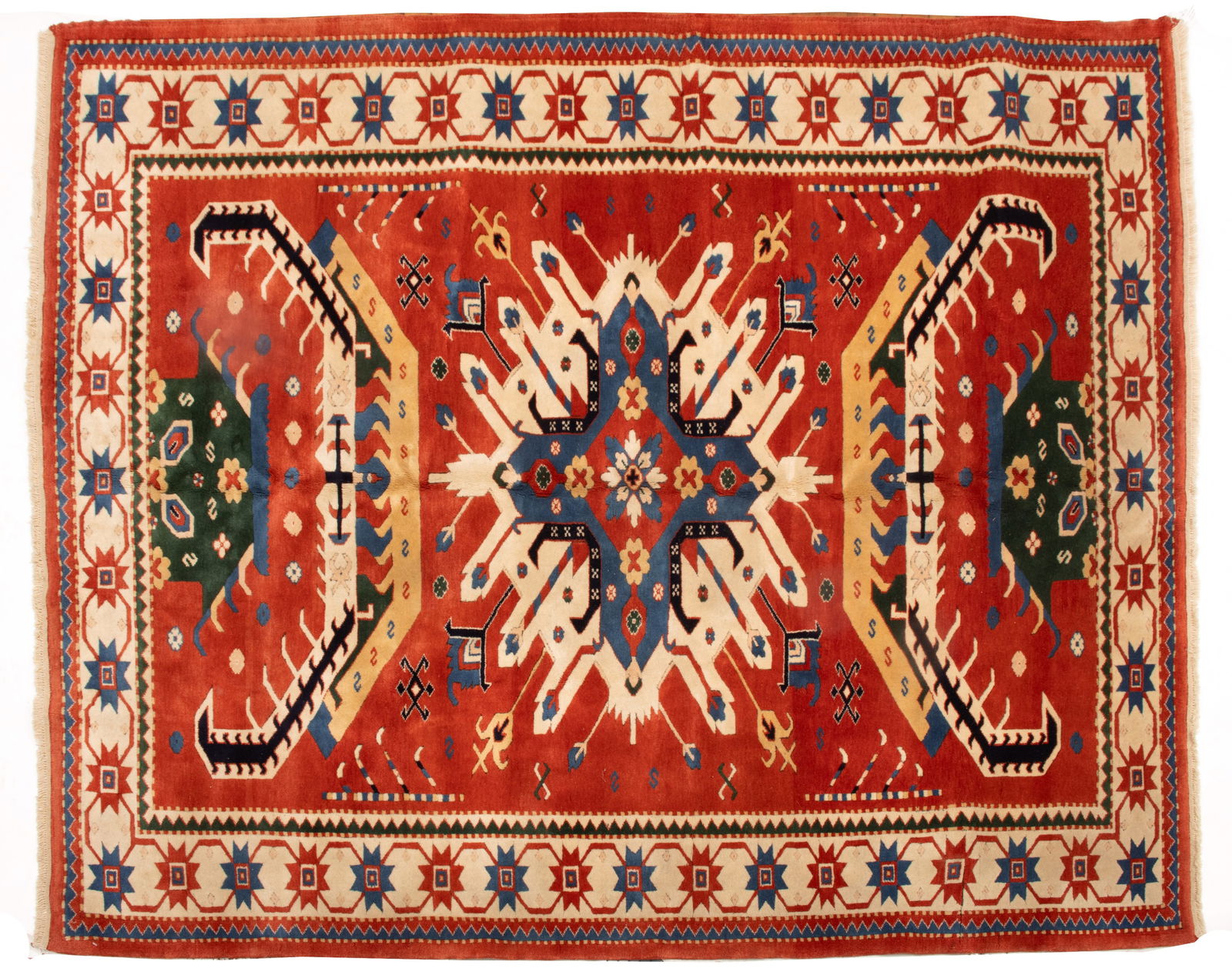Turkish Kazak Design Handwoven Wool Rug, 1980-1990, W 6' 7" L 8': Turkish Kazak Design Handwoven Wool Rug, 1980-1990, W 6' 7" L 8' Red field with dramatic geometric designs in green blue and ivory. Saw tooth borders. Provenance: Property from the collection o