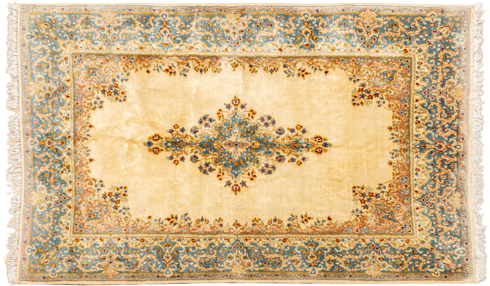 Persian Kerman Handwoven Wool Rug, Ca. 1970, W 6' 5" L 9' 8": Persian Kerman Handwoven Wool Rug, Ca. 1970, W 6' 5" L 9' 8" Ivory central field with floral medallion and border in light blue with red accents. Provenance: Property from the collection of Mar