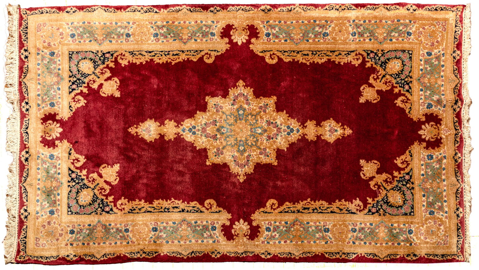 Persian Kerman Handwoven Wool Rug, Ca. 1960-1970, W 4' 10" L 7' 4": Persian Kerman Handwoven Wool Rug, Ca. 1960-1970, W 4' 10" L 7' 4" Royal burgundy field. Central floral medallion and border in pastel tones. Provenance: Property from the collection of Margara