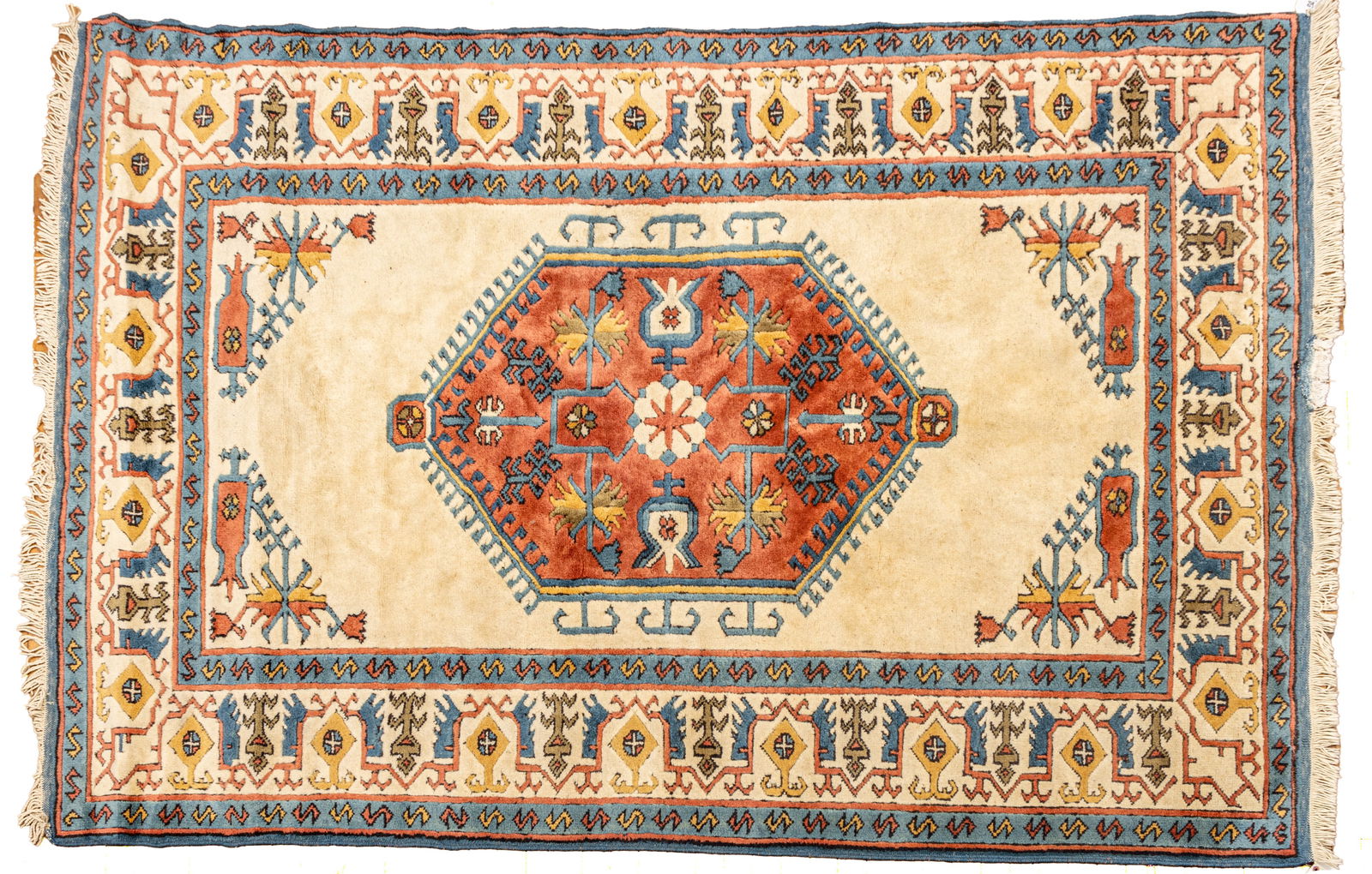Turkish Caucasian Style Handwoven Wool Rug, Ca. 1980, W 5' 10" L 8' 7": Turkish Caucasian Style Handwoven Wool Rug, Ca. 1980, W 5' 10" L 8' 7" Ivory field with salmon central medallion. Geometric floral and vine border. Provenance: Property from the collection of M