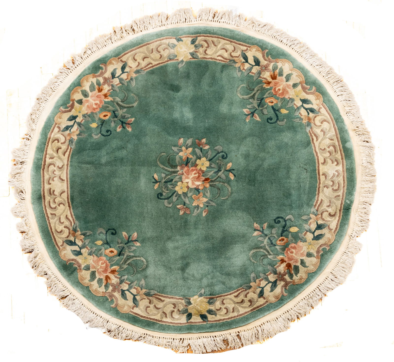 Chinese Handwoven and Sculputed Wool Rug, 1990, Dia. 5' 5": Chinese Handwoven and Sculputed Wool Rug, 1990, Dia. 5' 5" Teal ground with sculpture floral sprays. Provenance: Property from the collection of Margarat Weerakoon, Oak Park, MI Dimensions: Dia