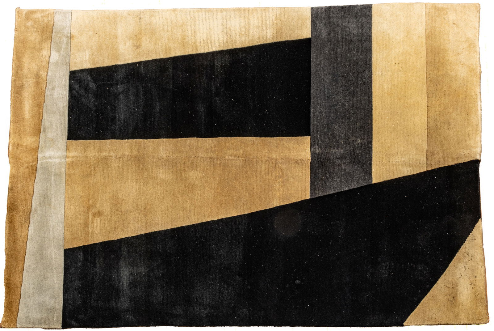 Couristan Kathmandu Hand Tufted Wool Rug, Ca. 1990, W 5' 7" L 7' 10": Couristan Kathmandu Hand Tufted Wool Rug, Ca. 1990, W 5' 7" L 7' 10" Geometric patterns in beige, grey and black. Provenance: Property from the collection of Margarat Weerakoon, Oak Park, MI Di