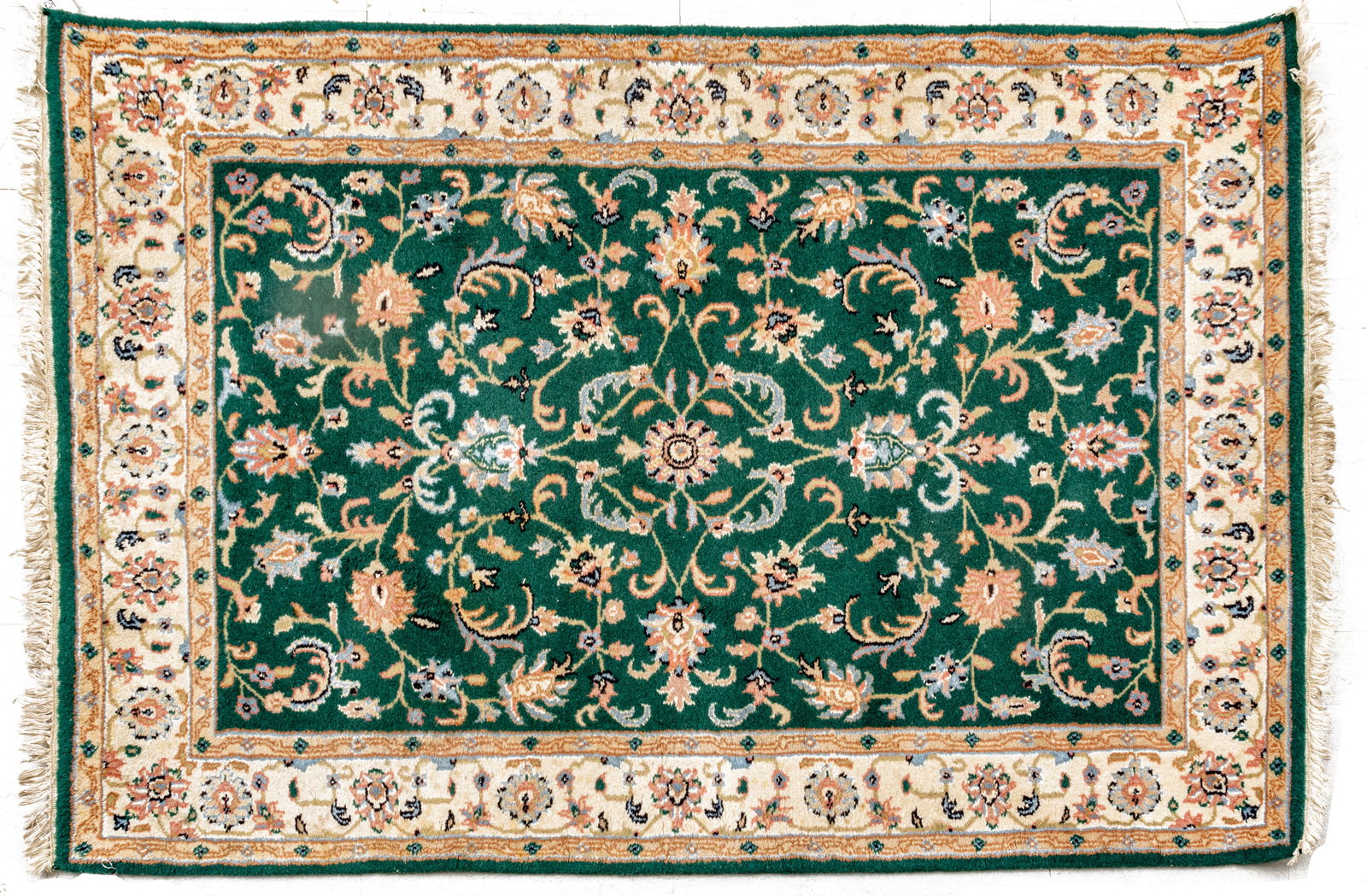Indo-Kerman Handwoven Wool Rug, Ca. 1980, W 4' 2" L 6': Indo-Kerman Handwoven Wool Rug, Ca. 1980, W 4' 2" L 6' Emerald green ground with overall floral sprays in powder blue, pink and indigo. Provenance: Property from the collection of Margarat Weerakoon,