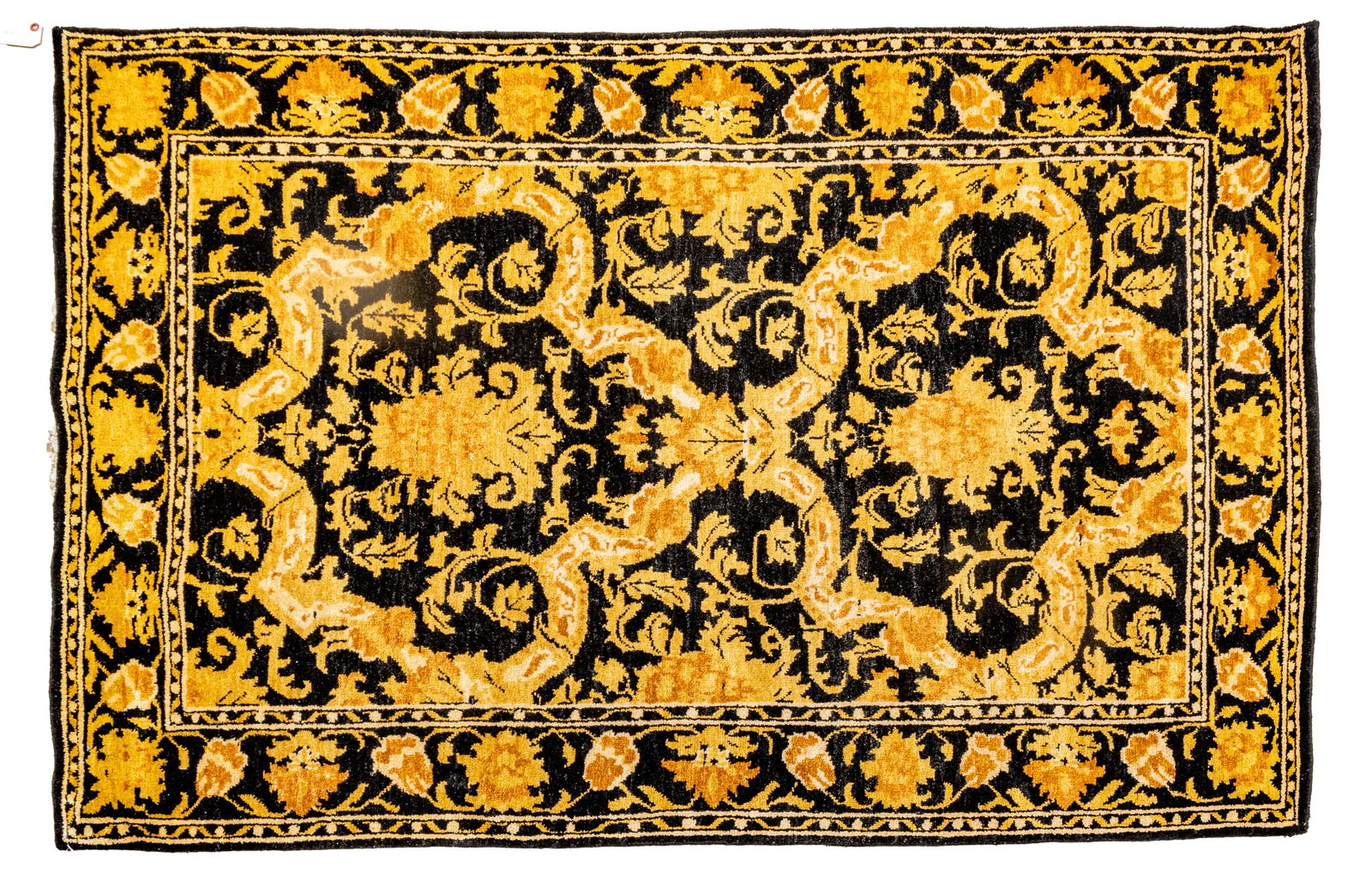 Indo-Oushak Design Handwoven Wool Rug, Ca. 1980, W 4' L 6' 1": Indo-Oushak Design Handwoven Wool Rug, Ca. 1980, W 4' L 6' 1" Black central field with scrolling floral and foliate designs. Provenance: Property from the collection of Margarat Weerakoon, Oak