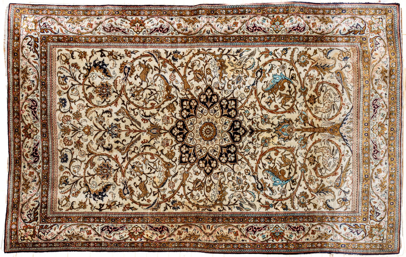 Persian Tabriz Handwoven Silk Tree of Life Rug, Mid 20th C., W 4' 6" L 6' 9": Persian Tabriz Handwoven Silk Tree of Life Rug, Mid 20th C., W 4' 6" L 6' 9" Handwoven silk on a silk foundation. Ivorycentral field scrolling tree of life and central navy medallion. Figures ofl