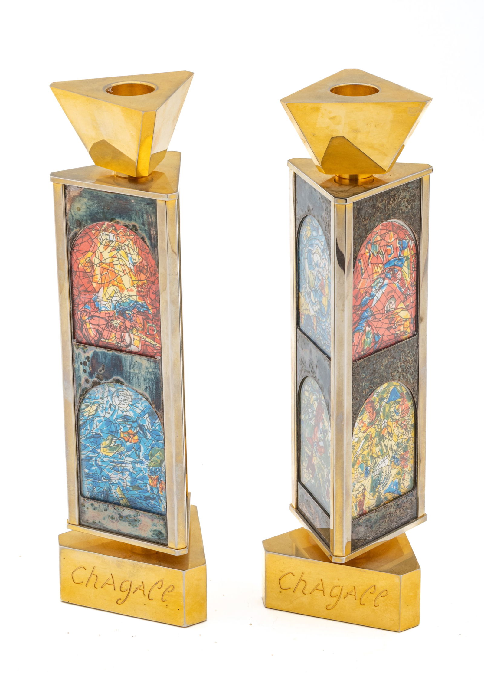 Marc Chagall (French/Russian, 1887-1985) Judaica 24K Gold Plated Triangular Rotating Candlesticks: Marc Chagall (French/Russian, 1887-1985) Judaica 24K Gold Plated Triangular Rotating Candlesticks with Silkscreen Prints from the Jerusalem Windows H 10" W 3" 1 PAIR Six images of the Jerusalem window