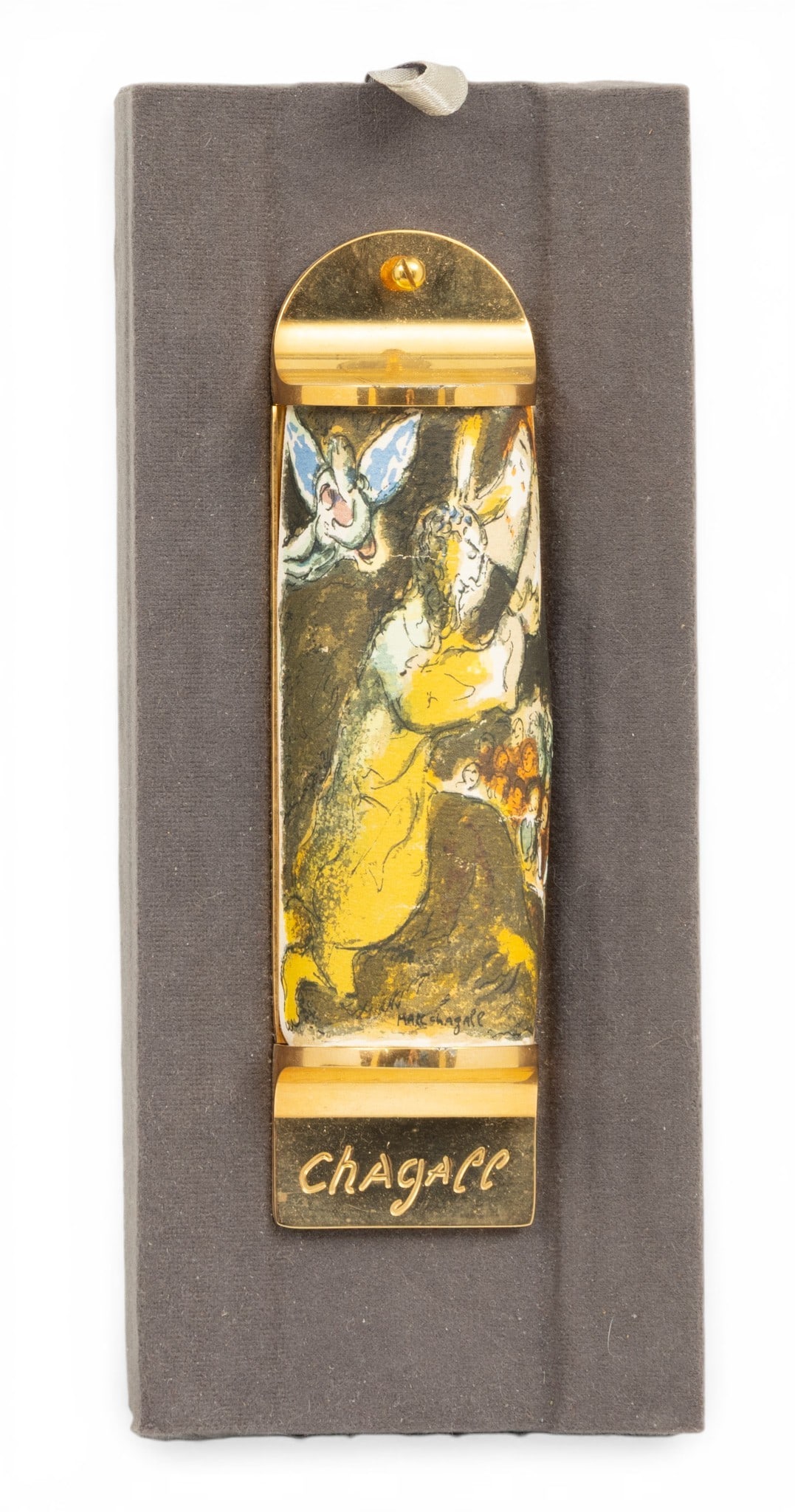 Marc Chagall (French/Russian, 1887-1985) Judaica Lithograph on 24K Gold Plate Mezuzah, in Fitted Box: Marc Chagall (French/Russian, 1887-1985) Judaica Lithograph on 24K Gold Plate Mezuzah, in Fitted Box #82 H 5.5" W 1.5" 1 PC Crafted for Congregation Shaarey Zedek of Southfield, Michigan. Limited edit