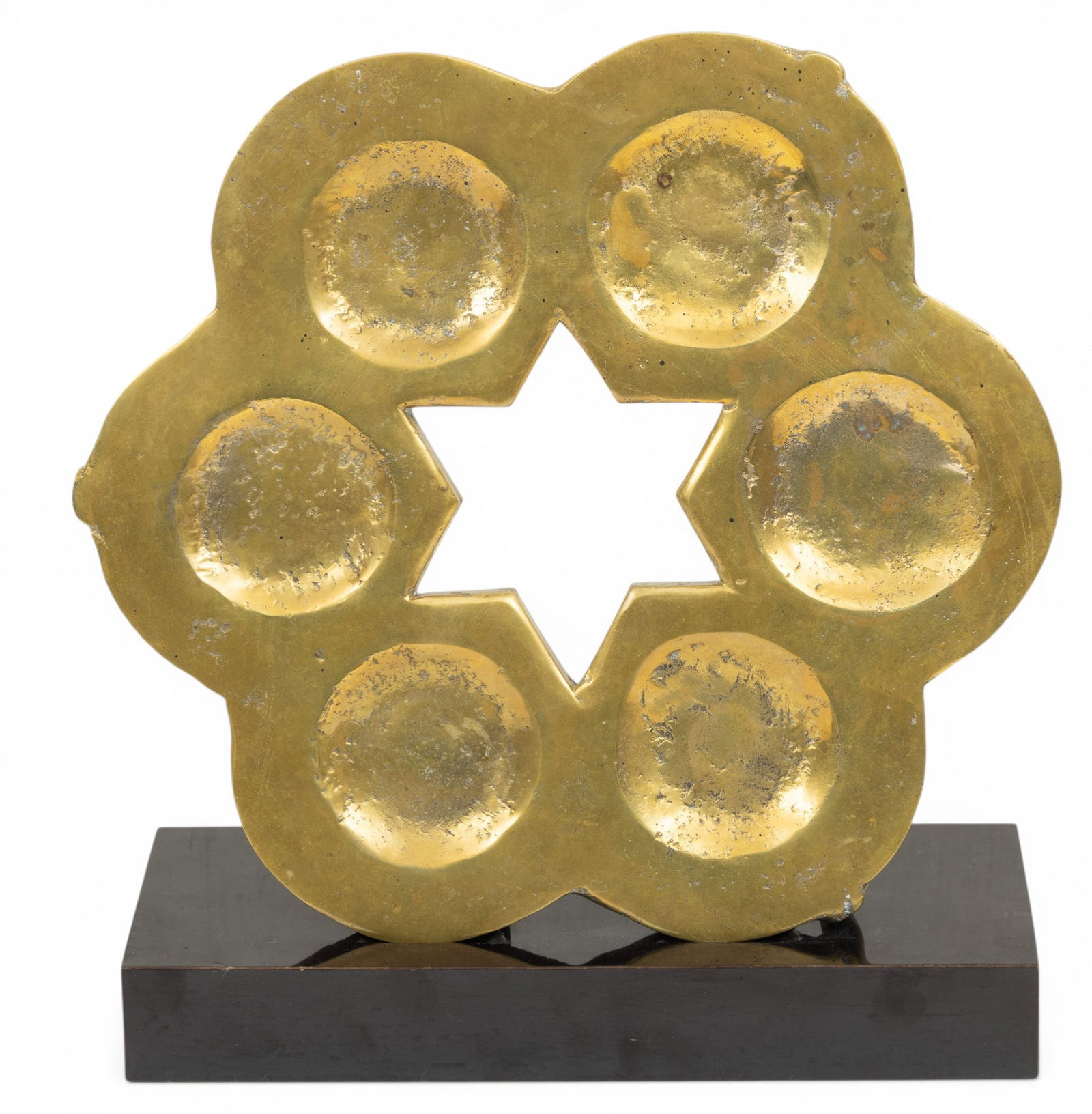 Judaica Brass Seder Plate, Plus Stand Modern, Dia. 14" 2 PCS: Judaica Brass Seder Plate, Plus Stand Modern, Dia. 14" 2 PCS Raised on three feet. Star at center. Six round dishes surround star. Black stand 13" x 5". 