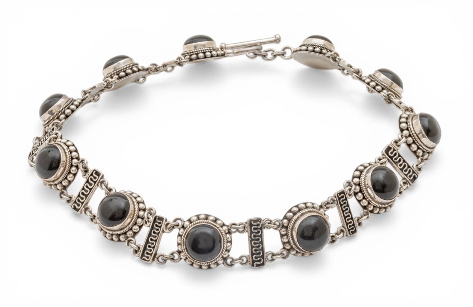 Sterling Silver and Black Onyx Link Necklace with Toggle L 14.5" 94 g 1 PC: Sterling Silver and Black Onyx Link Necklace with Toggle L 14.5" 94 g 1 PC 11 black onyx cabochons. Impressed 925 and BA. Bali Indonesia. Dimensions: L 14.5" 94 g 1 PC