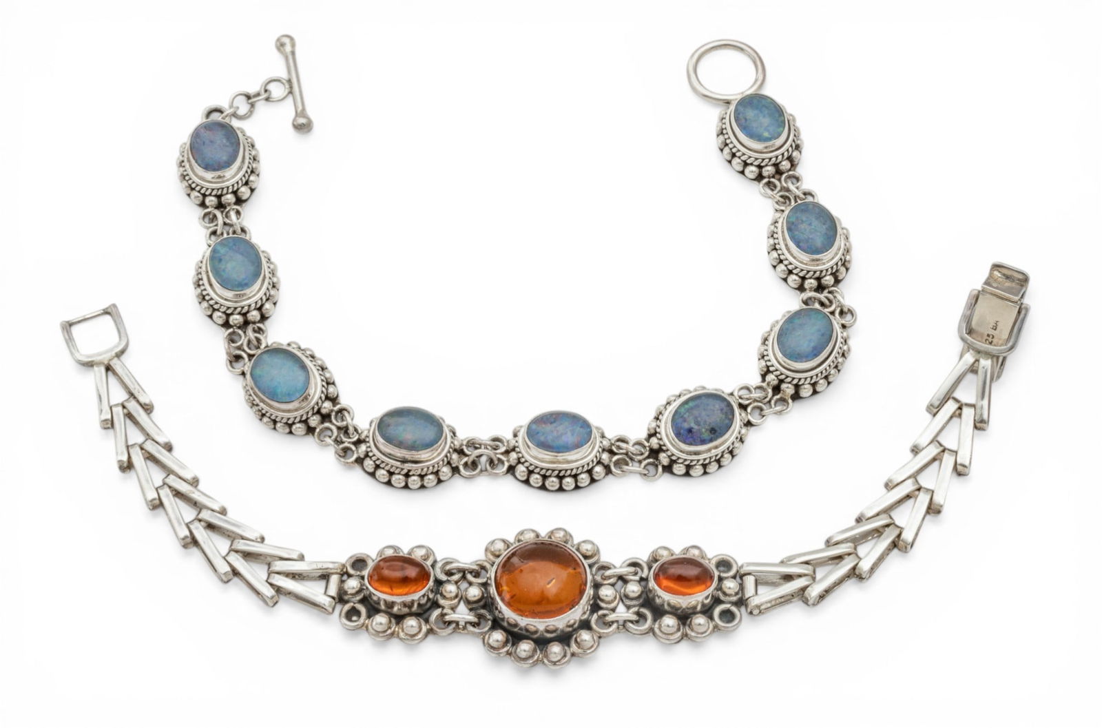 Sterling Silver Link Bracelets, 6.5" & 7" 52 g 2 PCS: Sterling Silver Link Bracelets, 6.5" & 7" 52 g 2 PCS One with 9 oval cabochon stones. One with three amber color stones. Impressed 925 and BA maker. Dimensions: 52 g 2 PCS