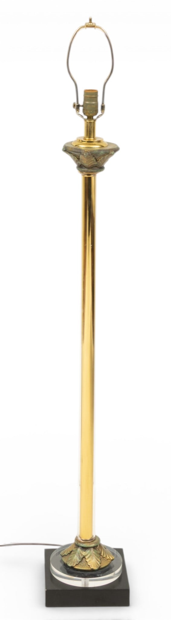 Wildwood Lamp Co. Post-Modern Lucite and Brass Floor Lamp H 54" W 8" L 8": Wildwood Lamp Co. Post-Modern Lucite and Brass Floor Lamp H 54" W 8" L 8" Brass and Lucite floor lamp with acanthus leaf details and green patina finish. Wildwood Lamp Company label adhered to socket.