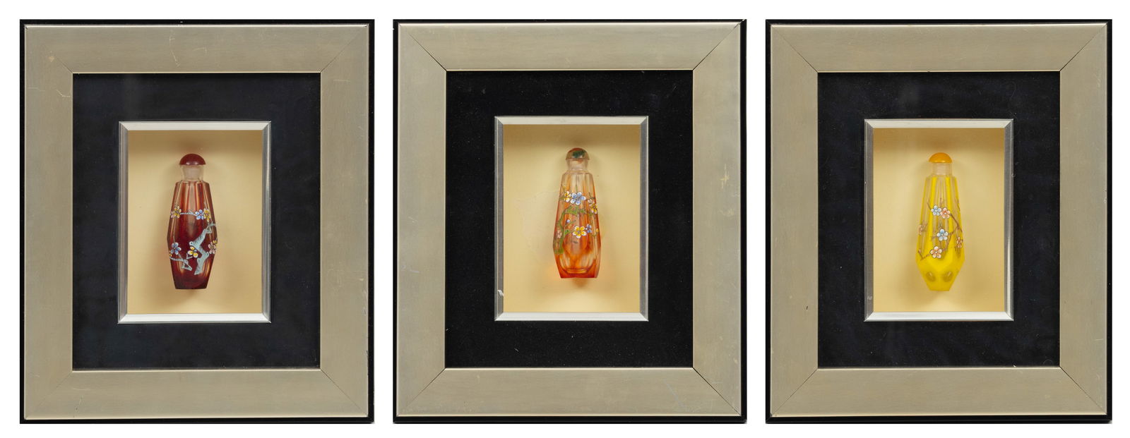 Chinese Enamel on Glass Snuff Bottles in Shadowbox Frames 20th C., H 9.5" W 8" Depth 1.5" 3 PCS: Chinese Enamel on Glass Snuff Bottles in Shadowbox Frames 20th C., H 9.5" W 8" Depth 1.5" 3 PCS Each snuff bottle of faceted form, 3". Adorned with hand painted enamel scenes of flowering branches.&nb