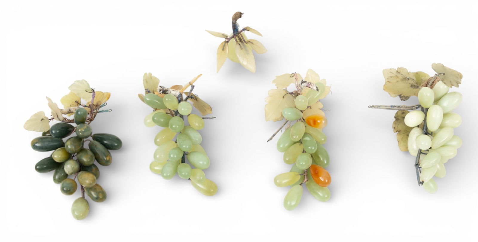 Chinese Hardstone Amethyst, Quartz, and Serpentine Grape Bunches, 1980, L 9" 5 PCS: Chinese Hardstone Amethyst, Quartz, and Serpentine Grape Bunches, 1980, L 9" 5 PCS Light and dark green serpentine grapes clustered as bunches on leafy stems. Provenance: Property of a Bl
