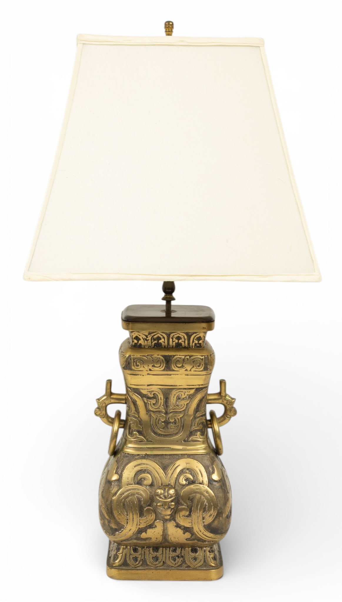 Chinese Cast Brass Hu Form Vase 1900, H 16" W 6" L 9.5": Chinese Cast Brass Hu Form Vase 1900, H 16" W 6" L 9.5" Ovid body with semi relief stylized animal masks adorning body, double ring handles adorn a polished brass patina. Unsigned. Overall height 31".