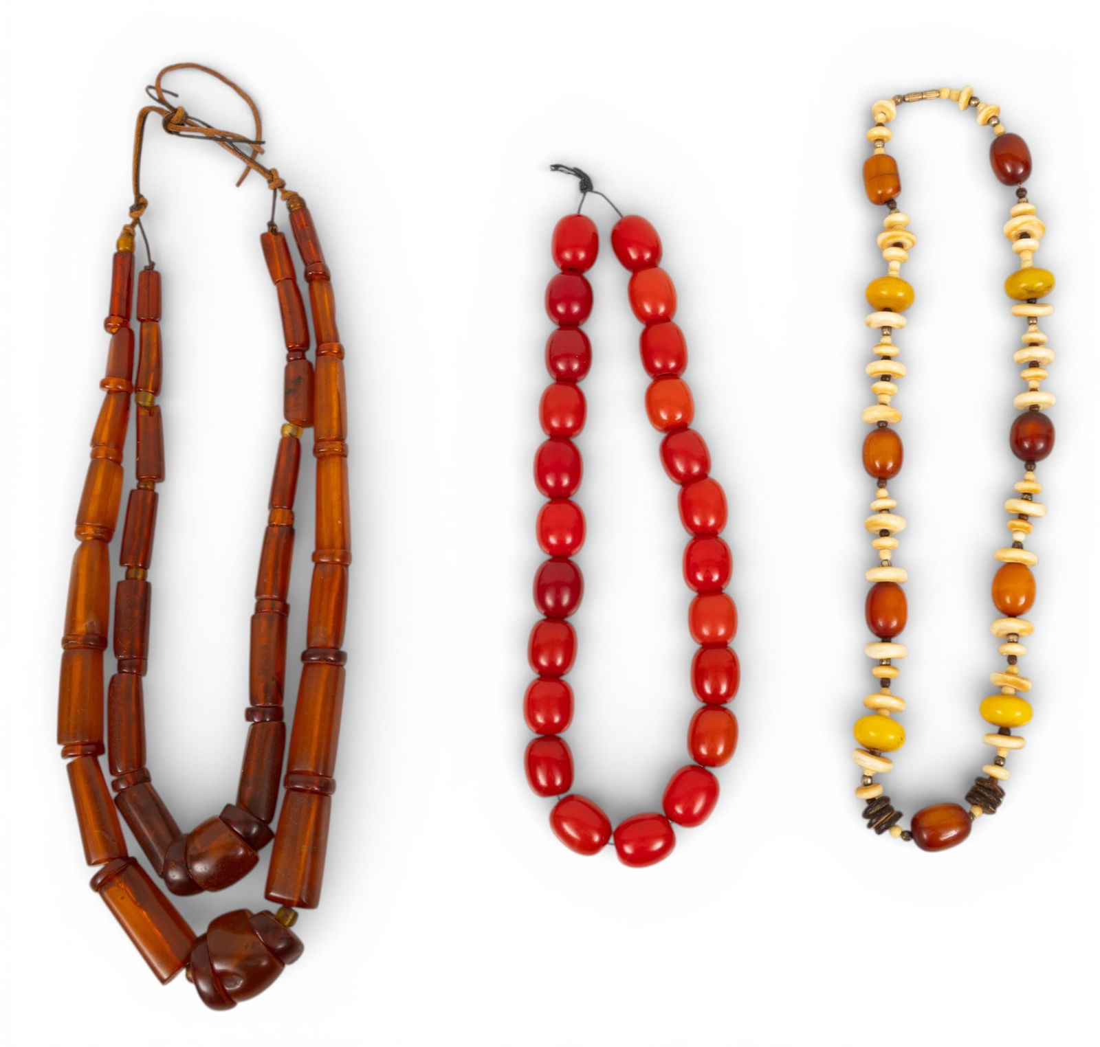 African Resin, Amber, and Bone Trade Bead Necklaces 3 PCS: African Resin, Amber, and Bone Trade Bead Necklaces 3 PCS Three African trade bead necklaces. Provenance: Property from a Midland, MI private collector Dimensions: Necklace 1 L 24" 1 PC Necklac