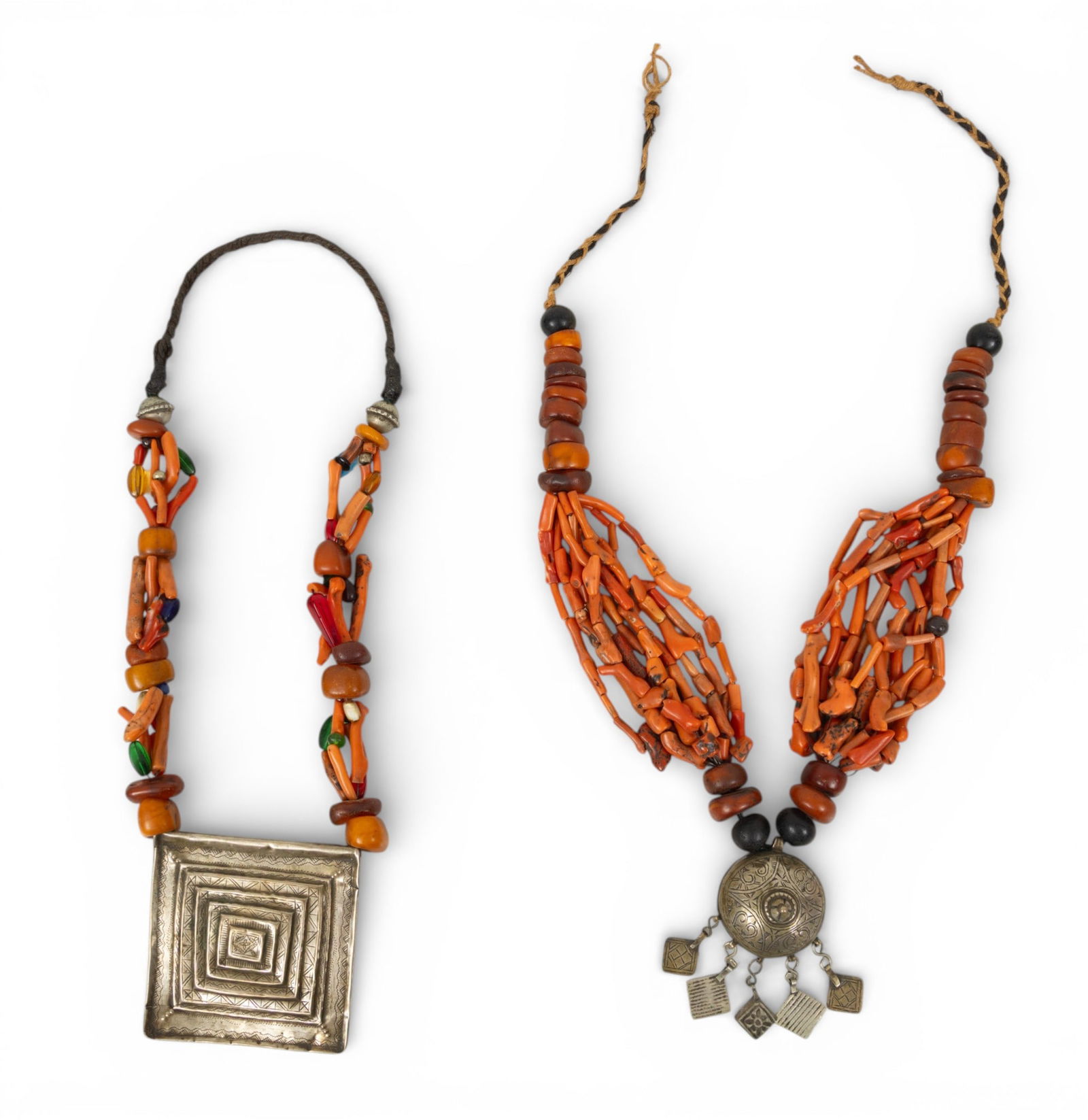 Two Amber and Coral Beaded Necklaces 2 PCS: Two Amber and Coral Beaded Necklaces 2 PCS One single coral beaded necklace having a large, square metal pendant. One multi-strand branch coral beaded necklace with fringed metal pendant. Proven