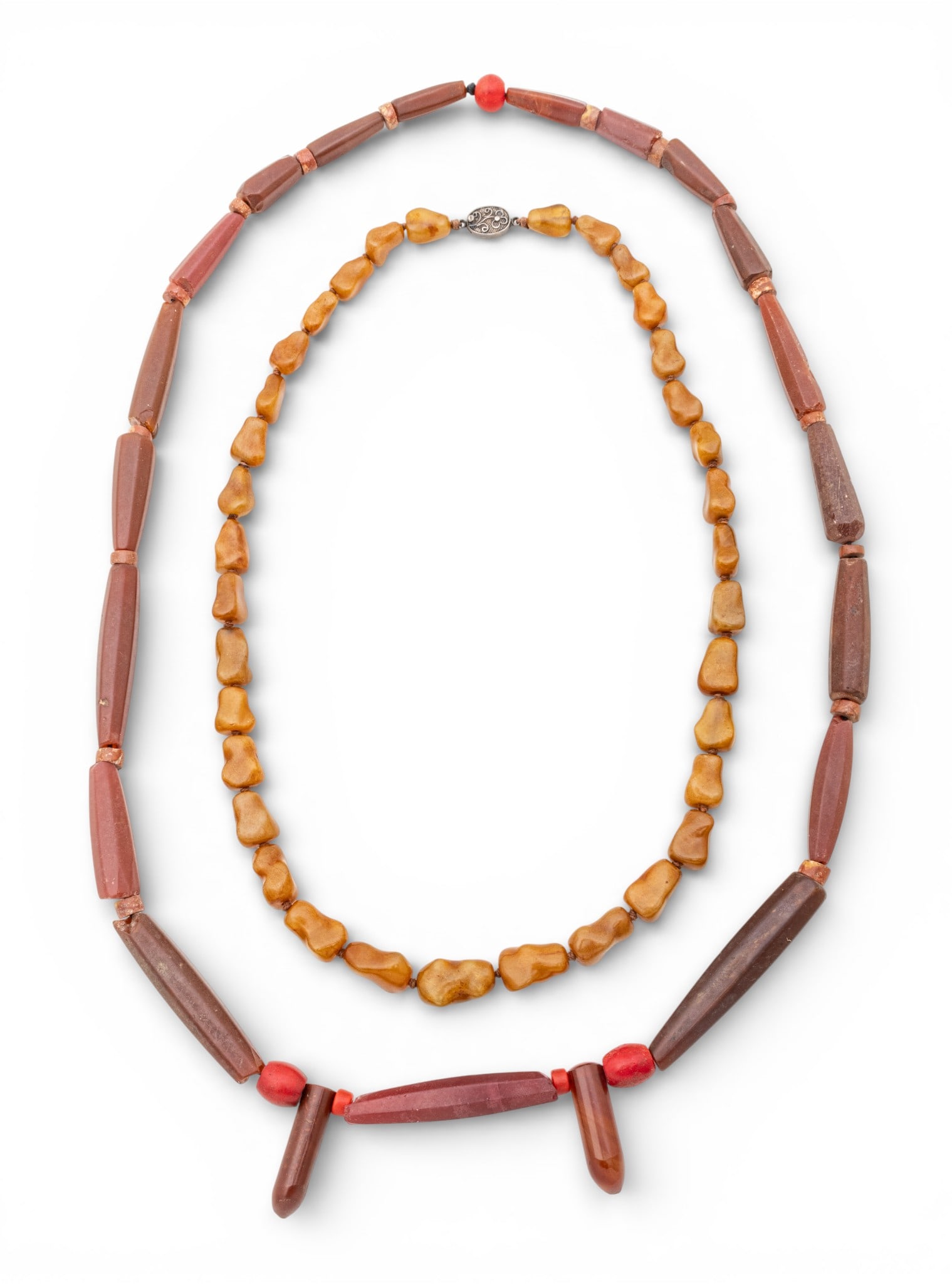 Two African Glass Trade Bead Necklaces, 2 PCS: Two African Glass Trade Bead Necklaces, 2 PCS Two African trade bead necklaces. Red bead necklace 34", brown bead necklace with metal clasp 24". Provenance: Property from a Bloomfield Township,
