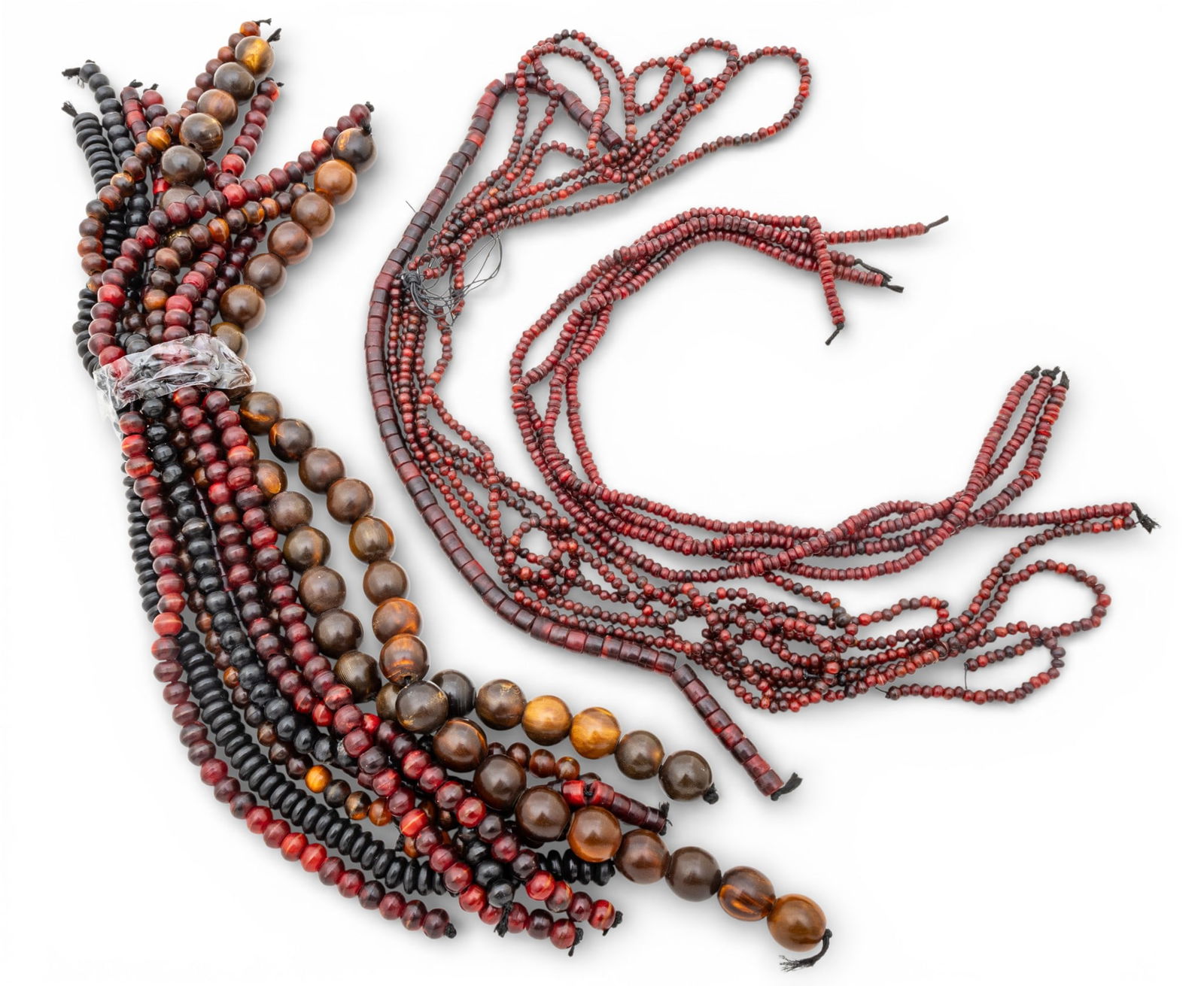 24 African Glass Trade Bead Strands 24 PCS: 24 African Glass Trade Bead Strands 24 PCS 24 red-brown African trade bead strands, 16 - 18 inches long. Provenance: Property from a Bloomfield Township, MI private collection. Dimensions: 24 PCS