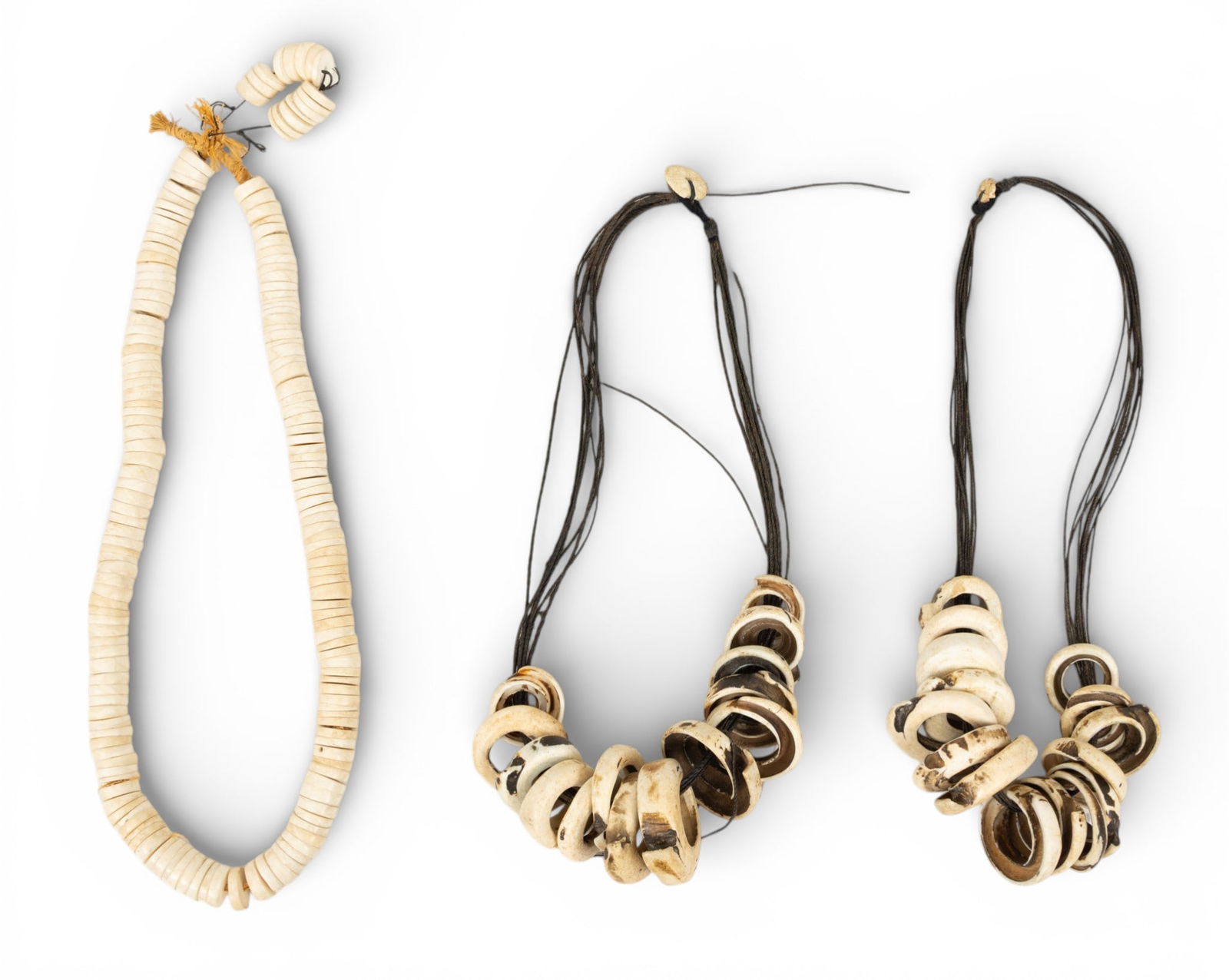 Three African Trade Bead Shell Necklaces 3 PCS: Three African Trade Bead Shell Necklaces 3 PCS Three African trade bead shell necklaces. Two "Lumi Money" or coin shell necklaces. Provenance: Property from a Midland, MI private collector Dime