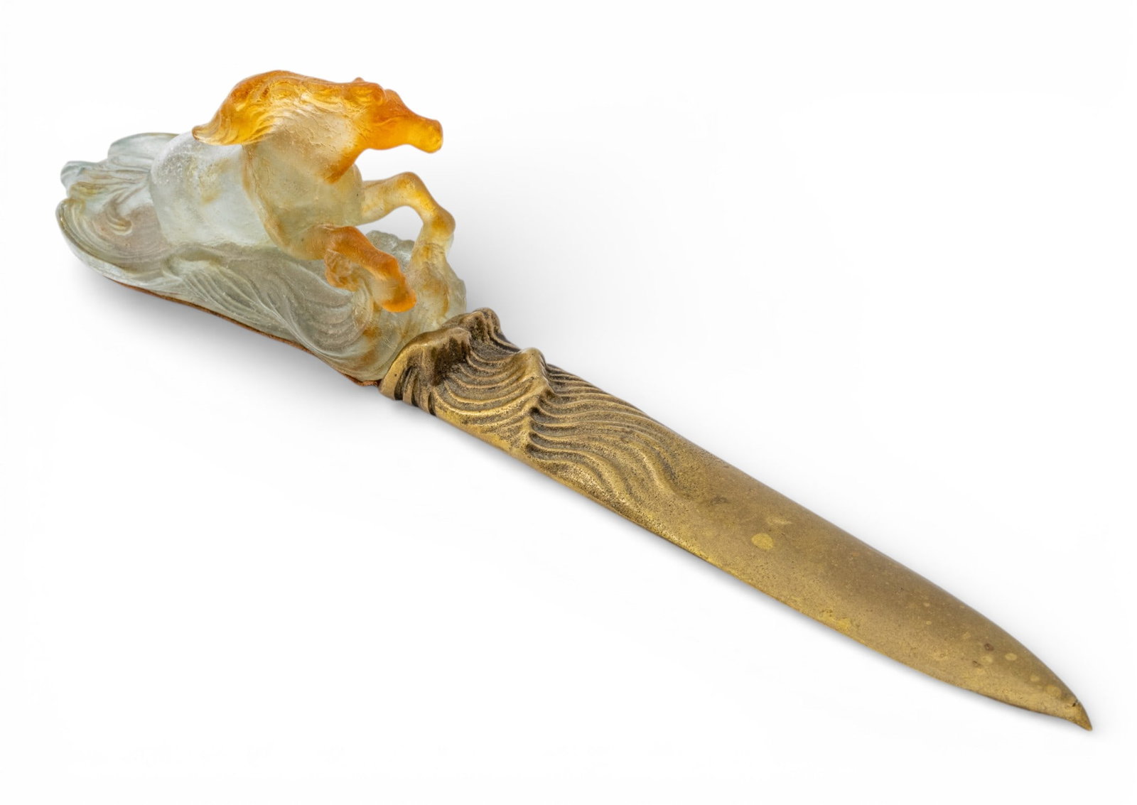 Daum (France) "Chevaux De Marly" Pate De Verre Letter Opener H 2.7" L 11": Daum (France) "Chevaux De Marly" Pate De Verre Letter Opener H 2.7" L 11" D2207. Hand made in frosted glass and amber. Leather pad under horse. Brass with indication of waves. Dimensions: H 2.7"