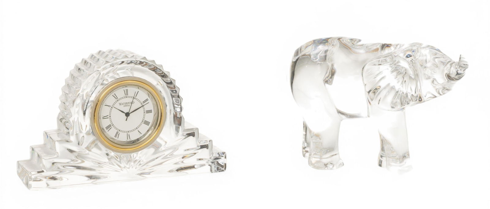 Waterford (Irish) Crystal Clock and Elephant Figurine H 2.5" W 4" 2 PCS: Waterford (Irish) Crystal Clock and Elephant Figurine H 2.5" W 4" 2 PCS (1.) Waterford Wharton pattern crystal mantel clock. (2.) Waterford Crystal elephant figurine. Dimensions: H 2.5" W 4"