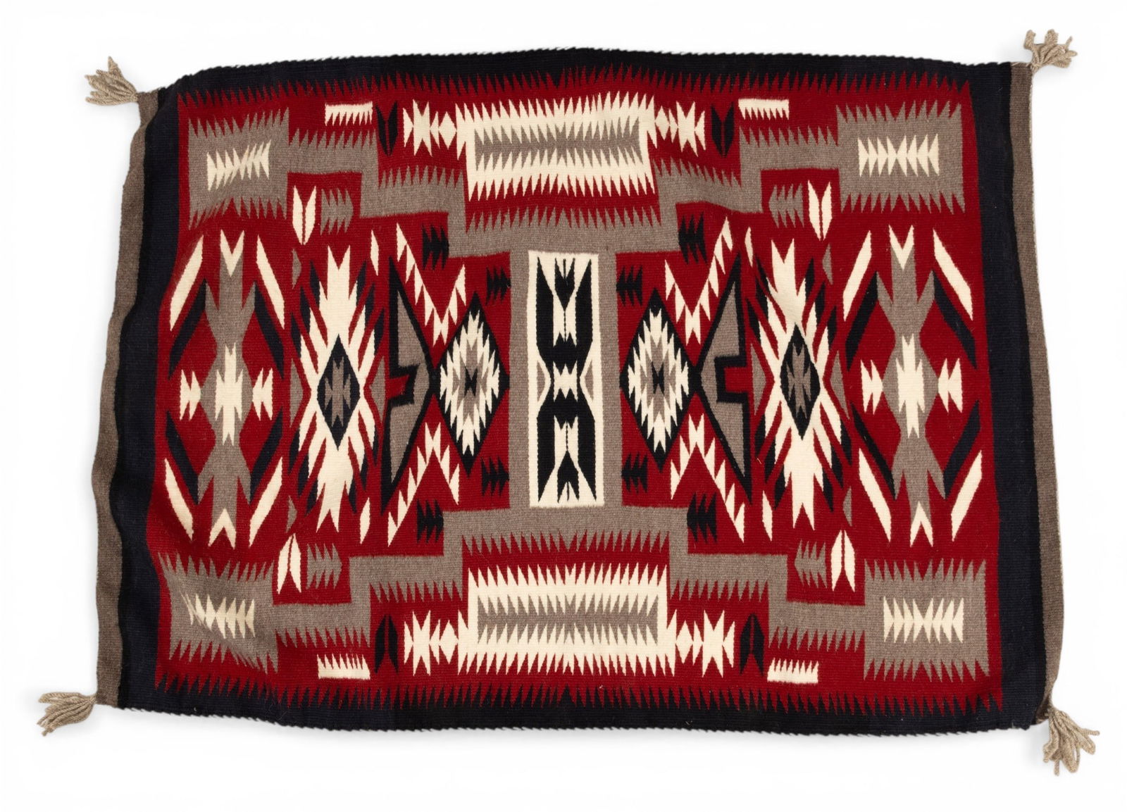 Navajo Hand Woven Wool Weaving 20th C., 'Storm Pattern', W 2' 4" L 3' 3": Navajo Hand Woven Wool Weaving 20th C., 'Storm Pattern', W 2' 4" L 3' 3" Red ground with pattern in White, grey, and indigo. Provenance: Property from the Estate Collection of Thomas Morton, Frankfor